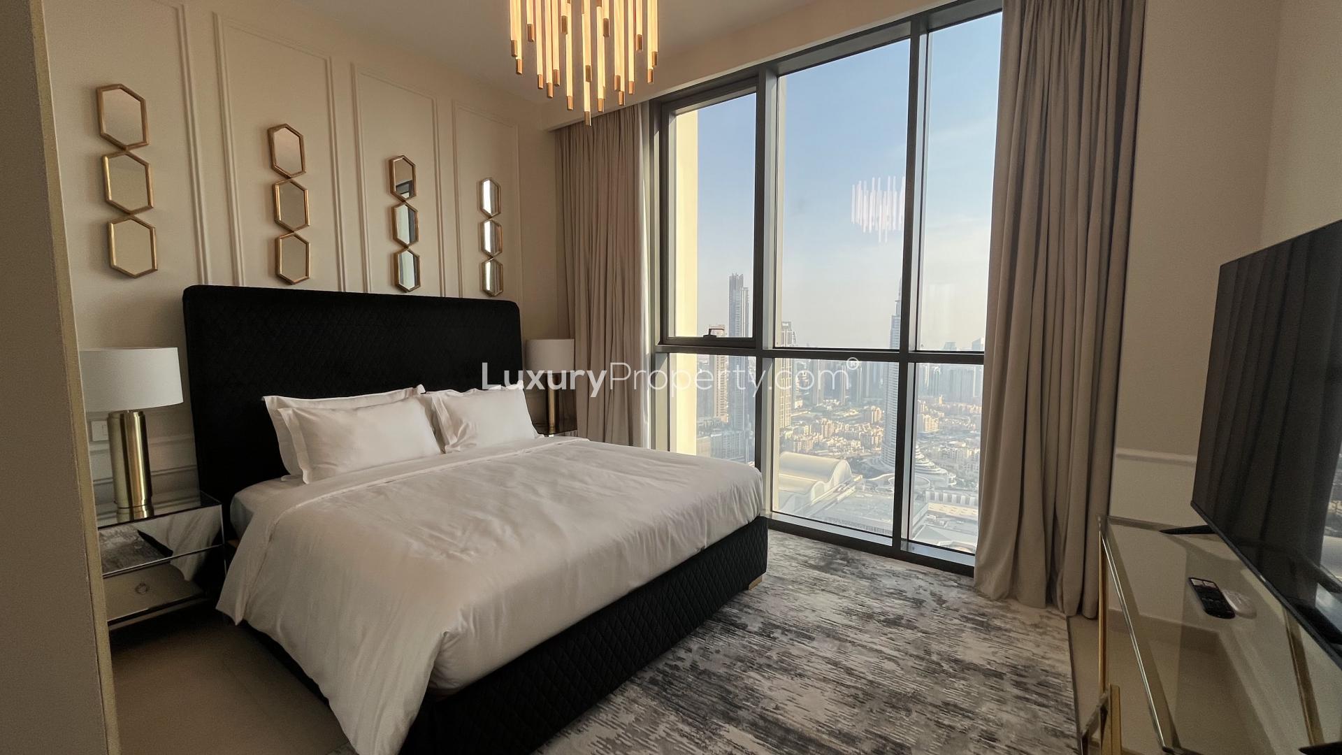 High-rise Downtown Dubai apartment bedroom with modern decor and luxurious furnishings for rent