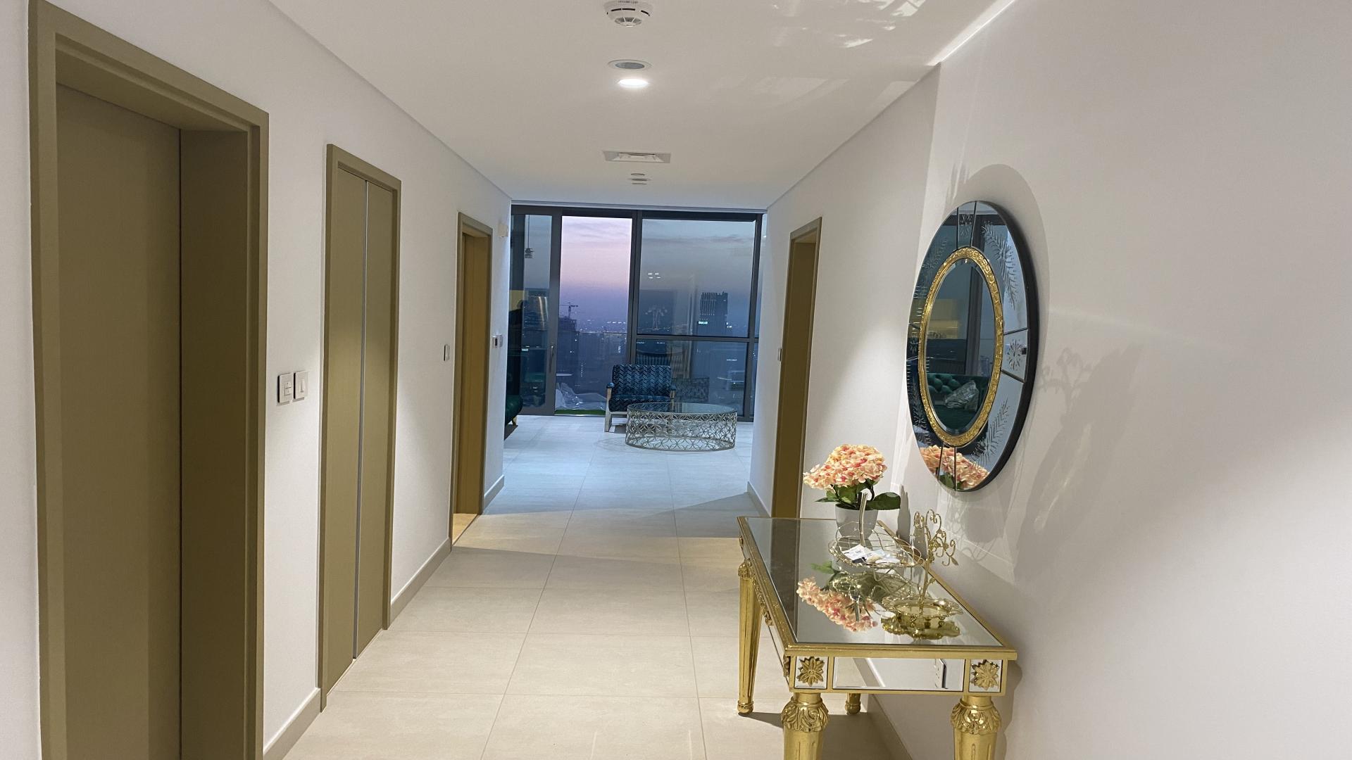 Modern Downtown Dubai apartment living room with Burj Khalifa view through large windows