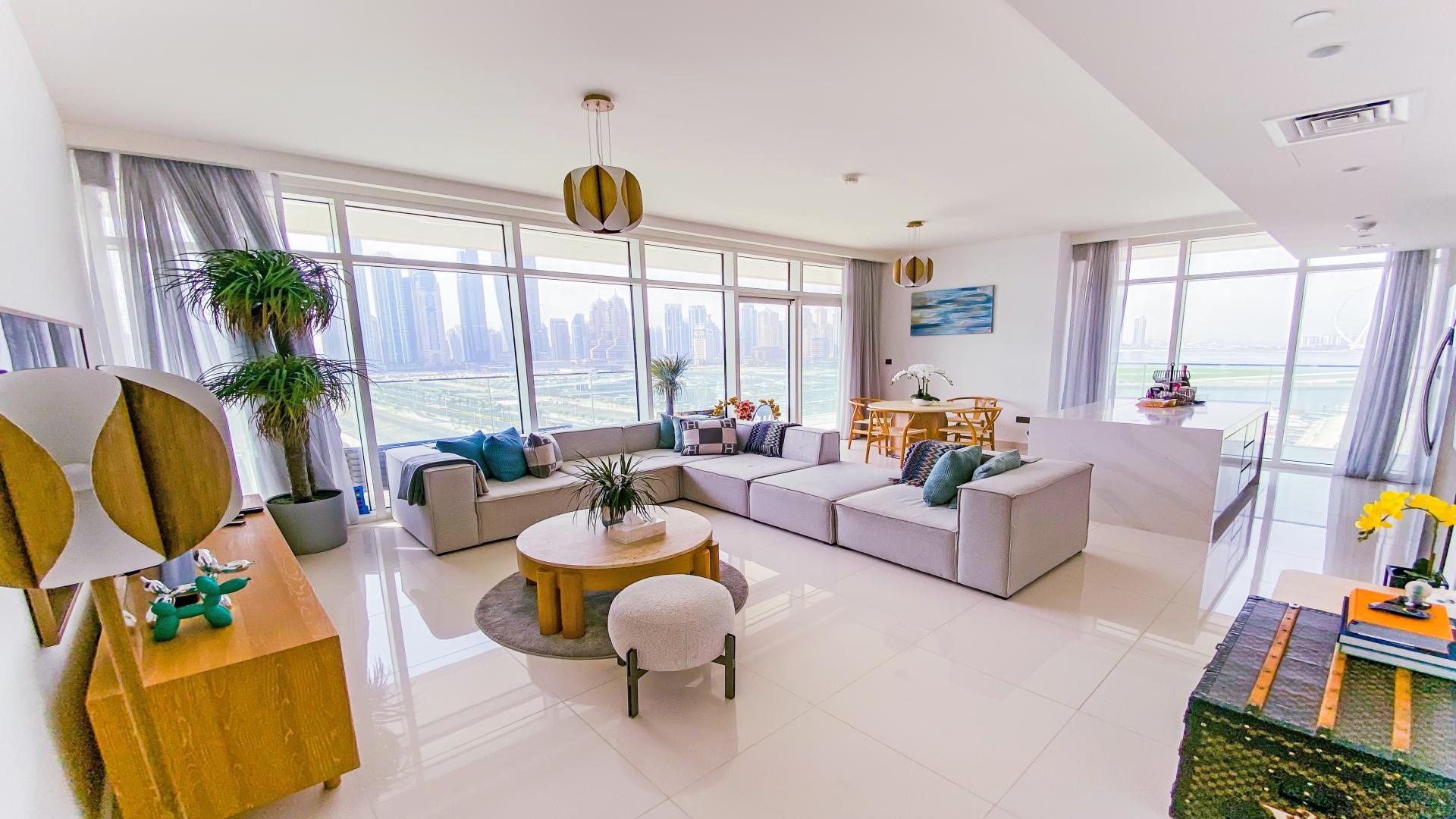 Balcony view from luxury beachfront apartment in Emaar Beachfront, Dubai Harbour, with marina skyline