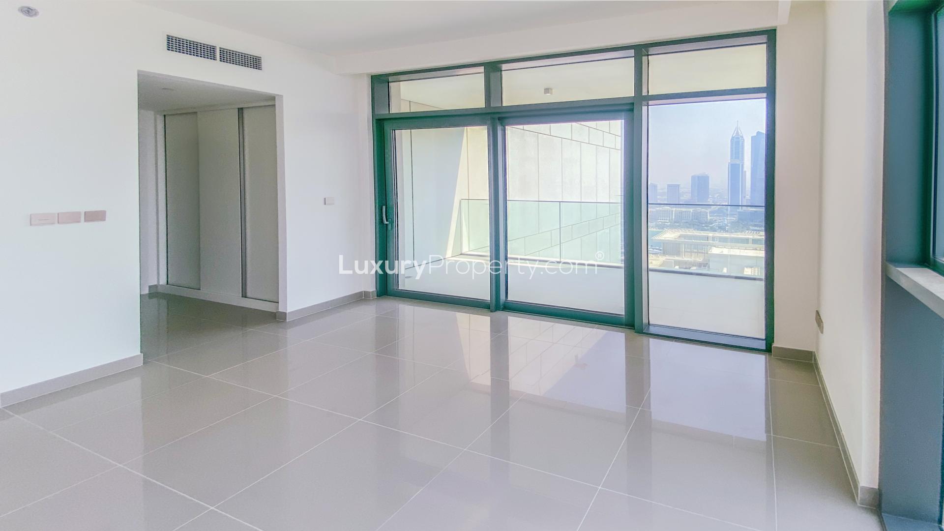 Brand new waterfront apartment interior with floor-to-ceiling windows in Emaar Beachfront, Dubai Harbour