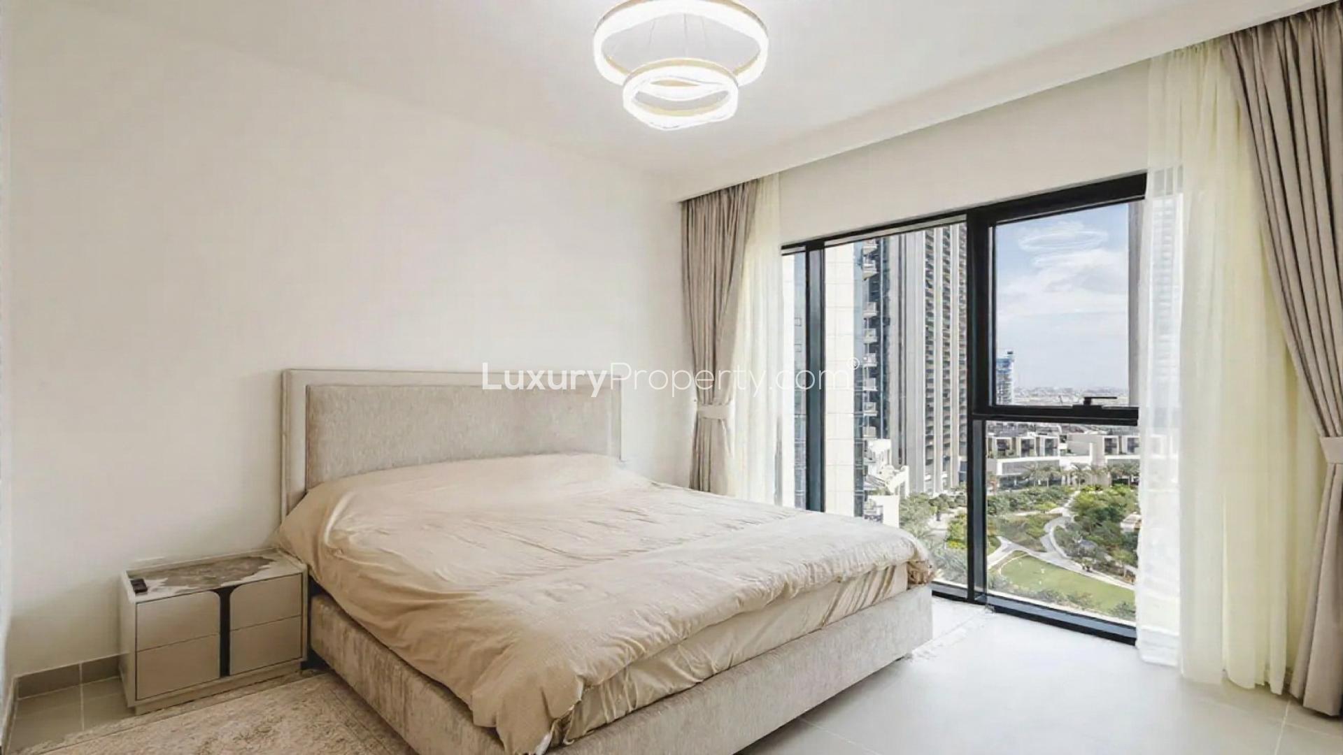 Modern kitchen in Dubai Creek Harbour apartment, featuring sleek cabinets and dining area