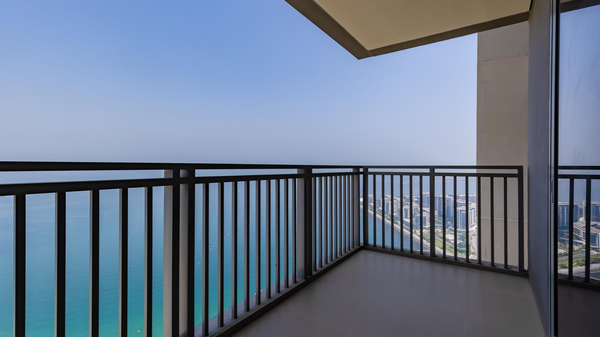 Empty living room with ocean view in Dubai Marina apartment for rent