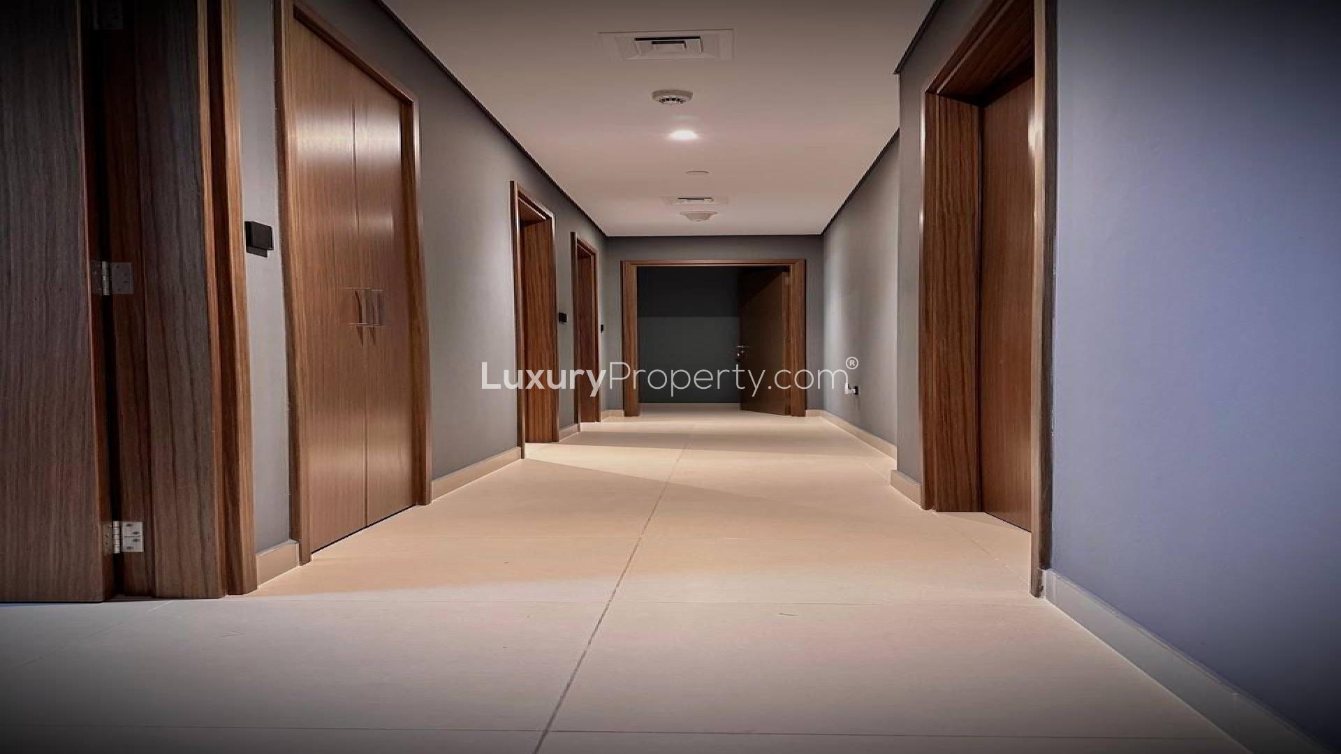 Modern interior design in Dubai Marina apartment, featuring mirror and green plant accents