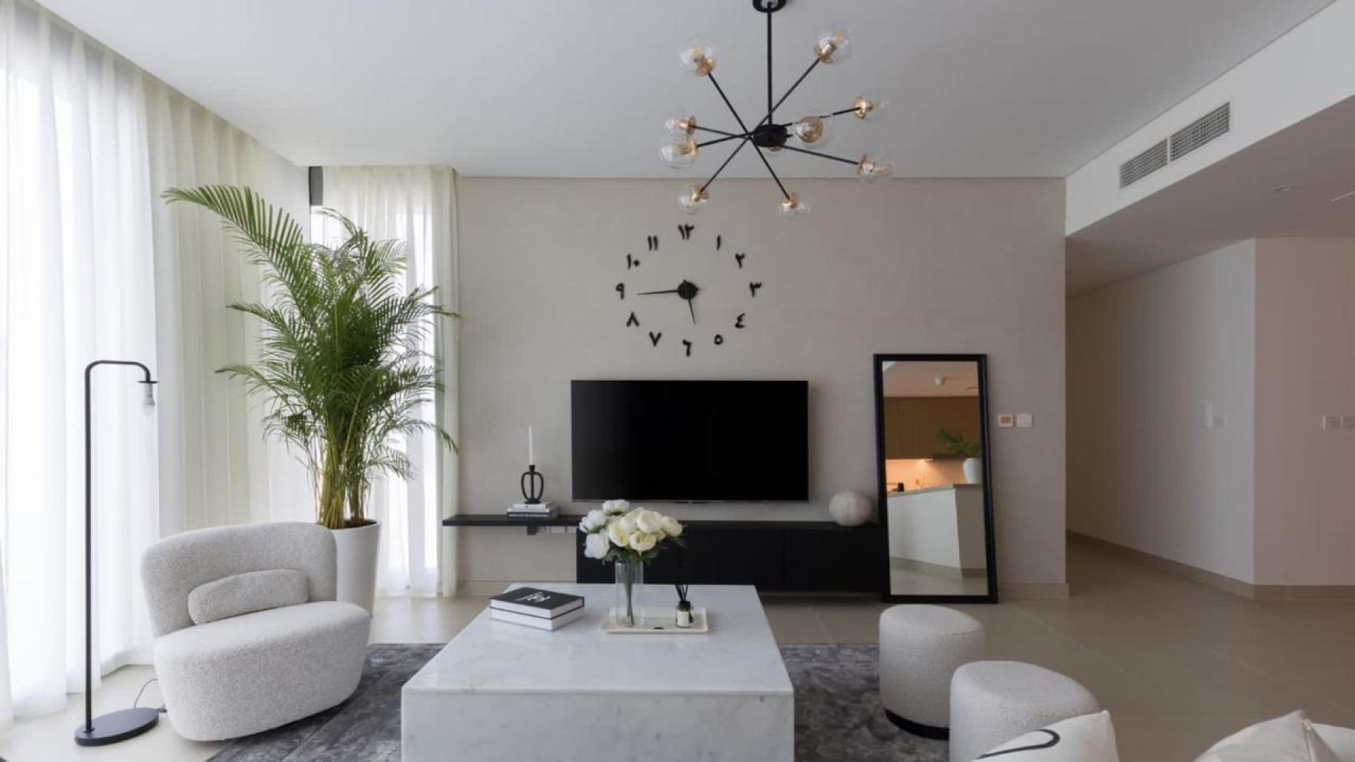 Modern living room in Marsa Dubai apartment, featuring elegant decor and natural light