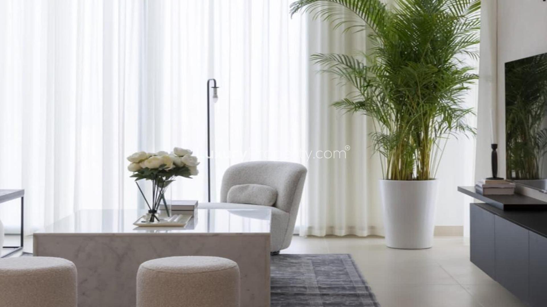 Modern open-plan living room and kitchen in Marsa Dubai apartment for rent