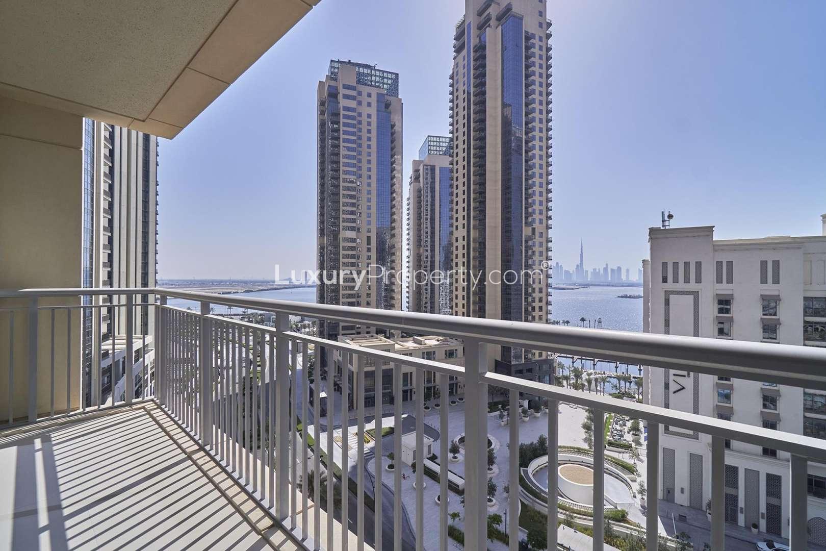 "Balcony view from 3-bedroom apartment in Dubai Creek Harbour overlooking Burj Khalifa skyline.",Brand-new apartment interior in Dubai Creek Harbour, spacious room with modern finishes