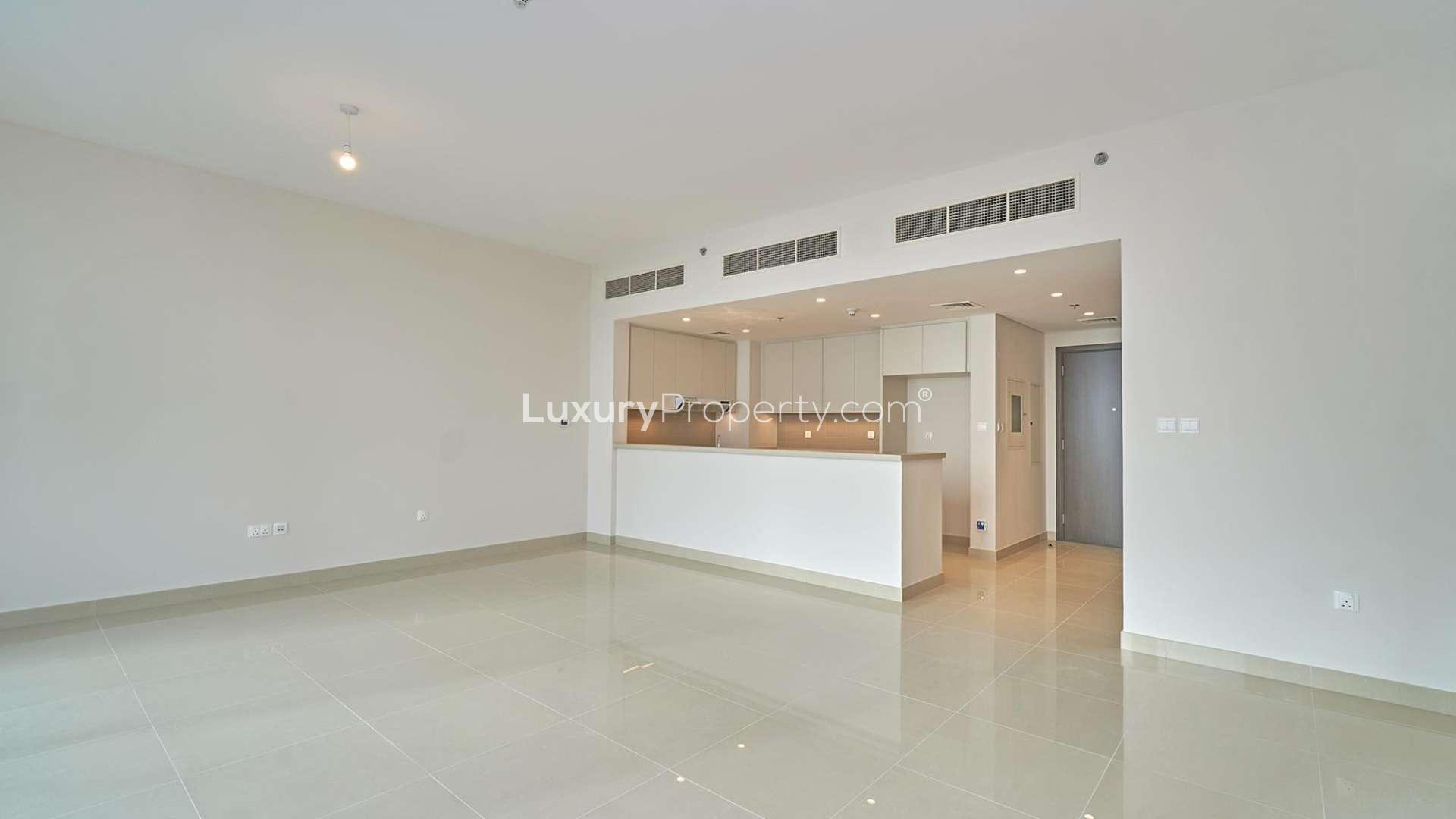 Modern bathroom with sink, mirror, and toilet in Dubai Creek Harbour apartment for rent