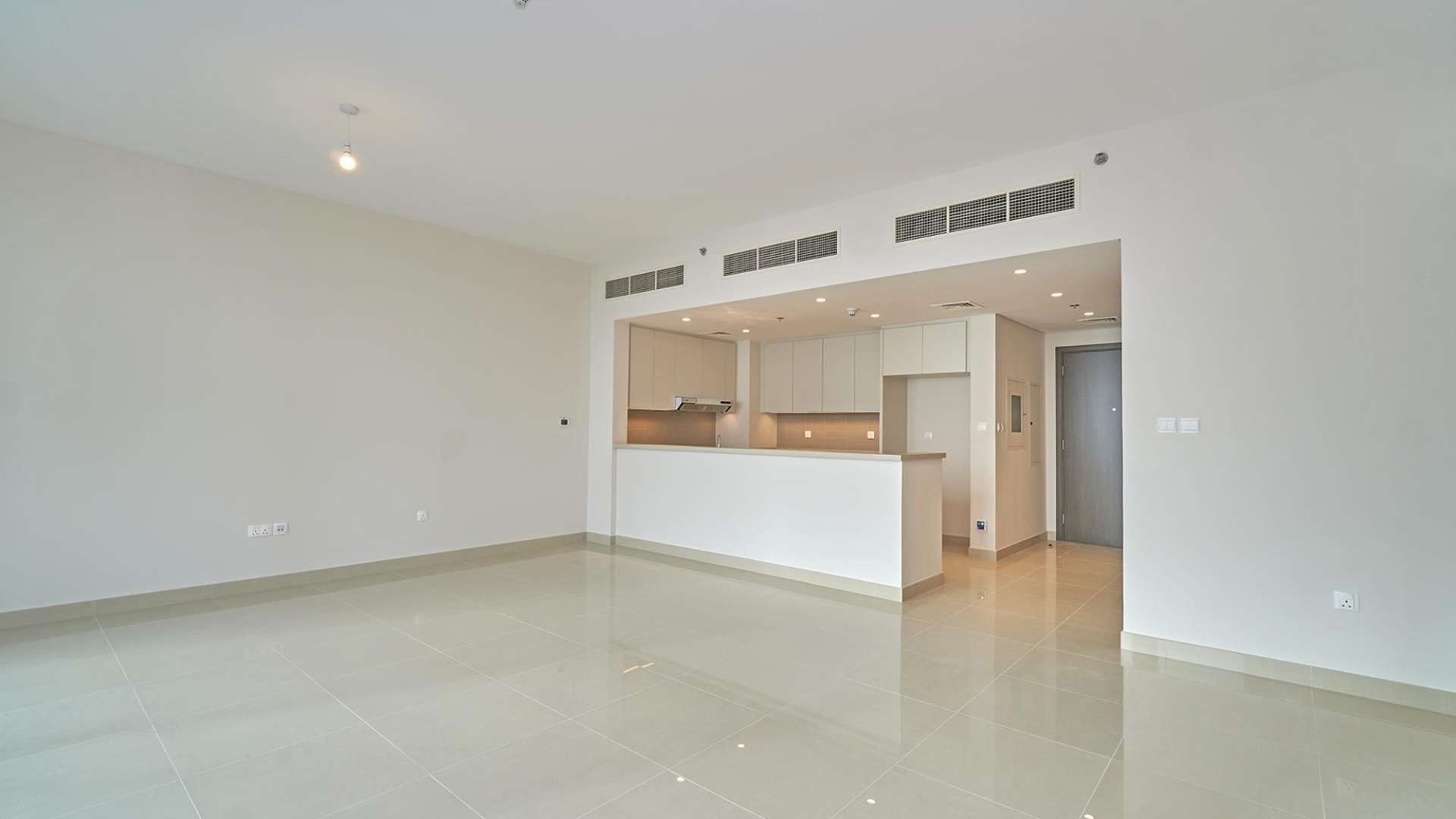 Modern bathroom with sink, mirror, and toilet in Dubai Creek Harbour apartment for rent