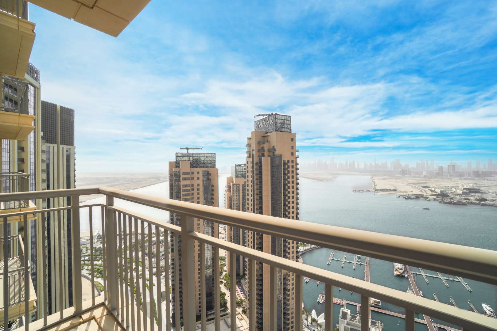 "Spacious kitchen and living area in 3-bedroom apartment, Harbour Views Tower 1, Dubai Creek Harbour.","Stunning view from balcony of 3-bedroom apartment in Harbour Views Tower 1, Dubai Creek Harbour.",Spacious living area with large windows in Harbour Views Tower 1, Dubai Creek Harbour