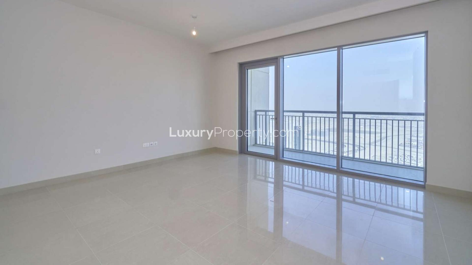 Bright living room in Harbour Views Tower 1 apartment, Dubai Creek Harbour, with balcony view