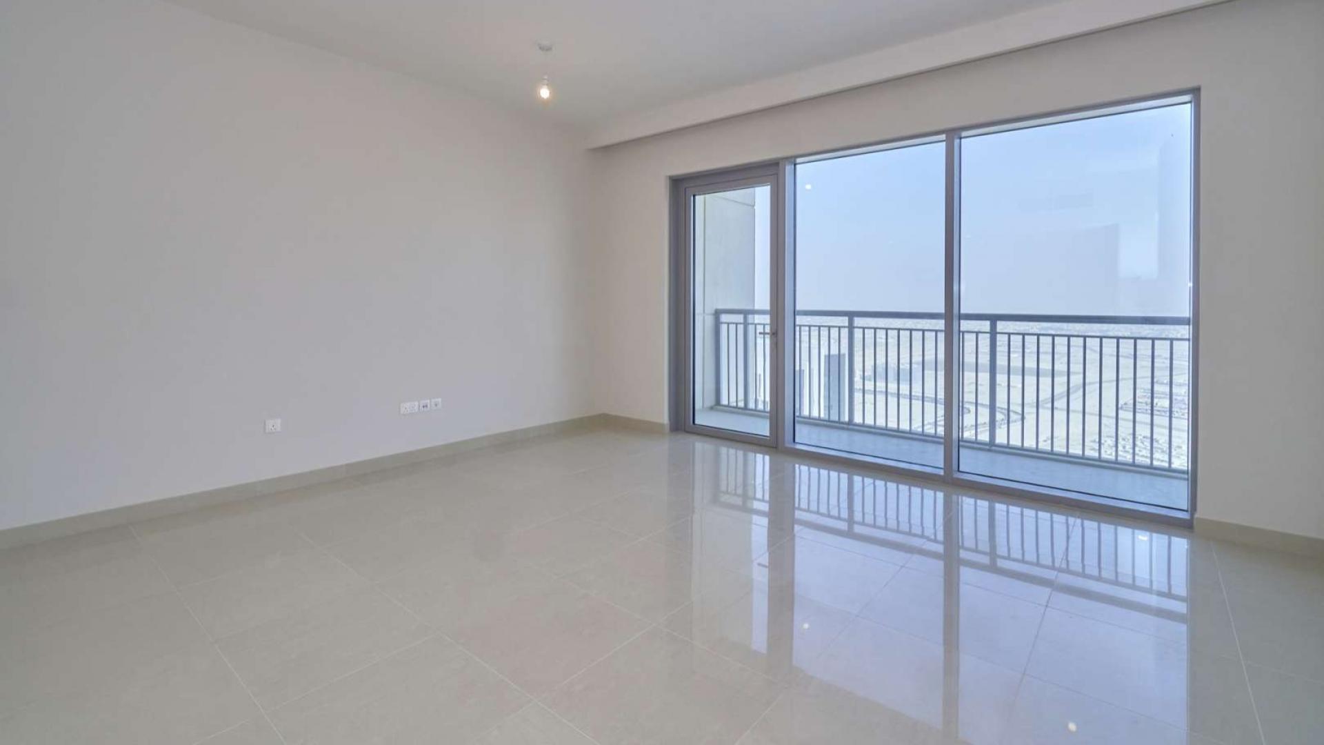 Bright living room in Harbour Views Tower 1 apartment, Dubai Creek Harbour, with balcony view
