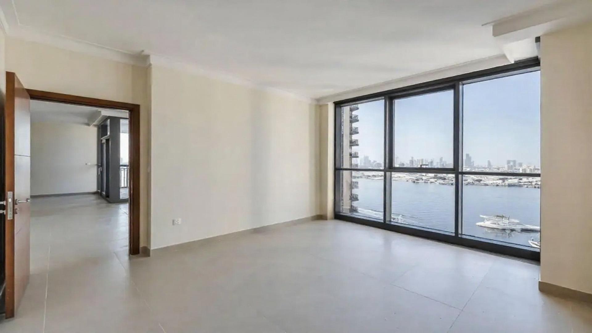 Spacious living area with floor-to-ceiling windows, Dubai Creek Harbour view, apartment for rent