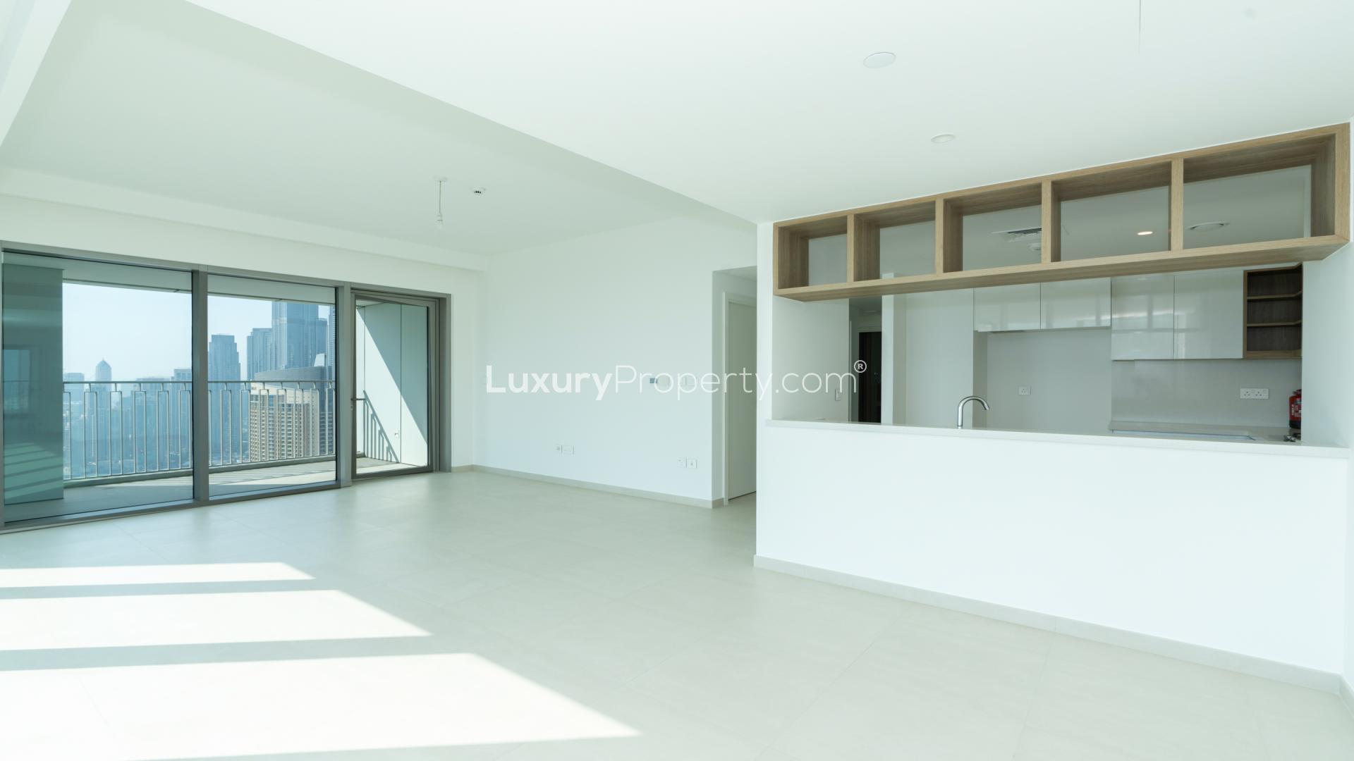 Spacious living room with large windows and stunning Downtown Dubai views in apartment