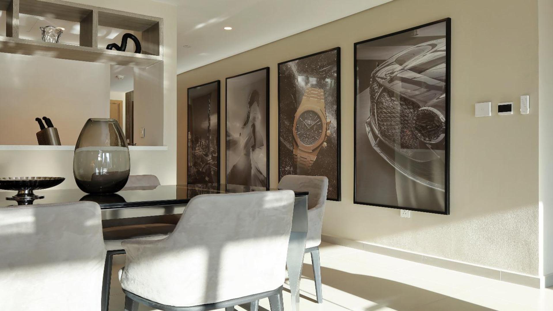 Fully furnished living room in Downtown Views II apartment, Downtown Dubai, with city views