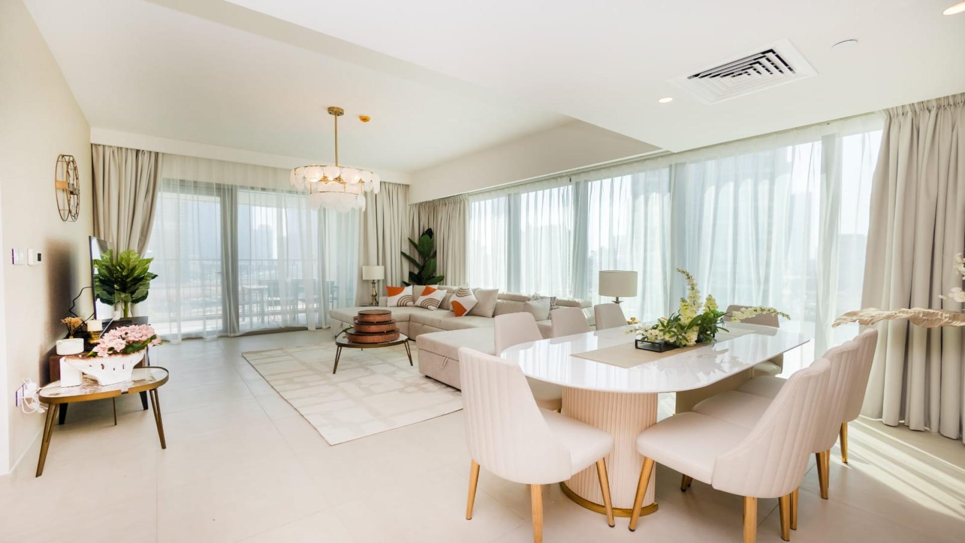 Bright living room in Downtown Dubai apartment with modern decor and large windows