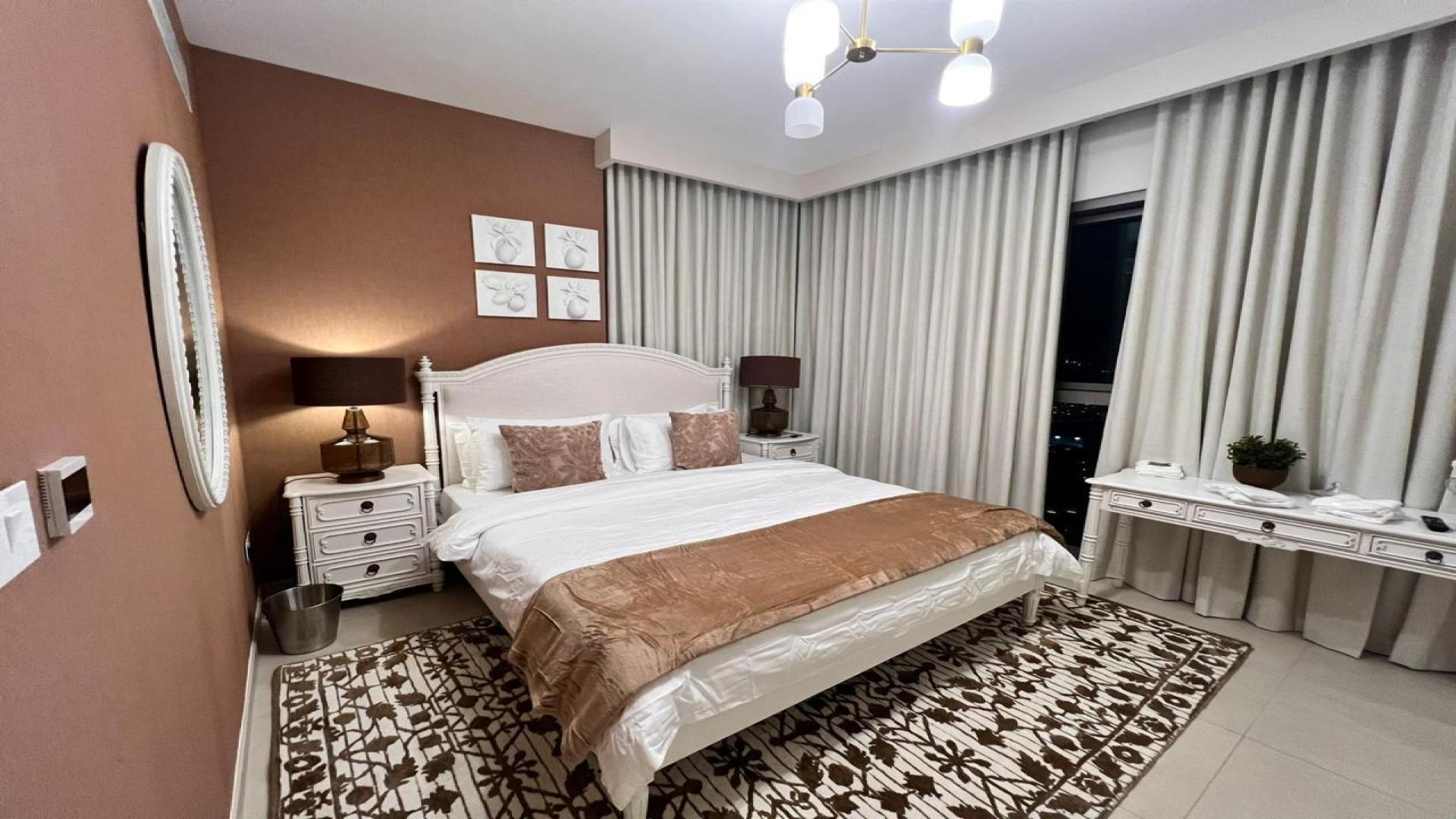 Modern kitchen in Downtown Dubai 3-bedroom apartment, featuring sleek appliances and spacious counters