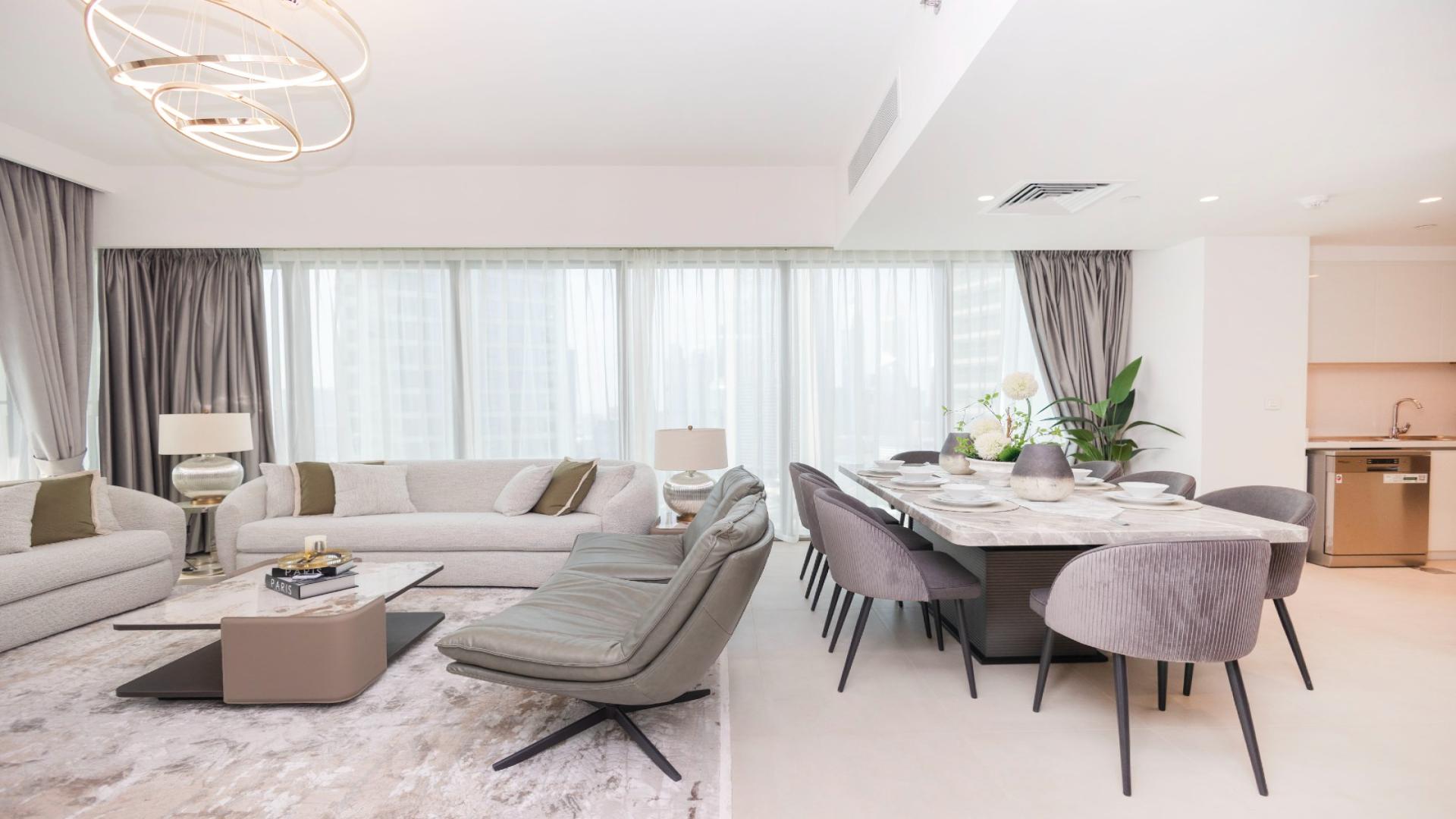 Fully furnished living and dining area in Downtown Dubai apartment with modern decor