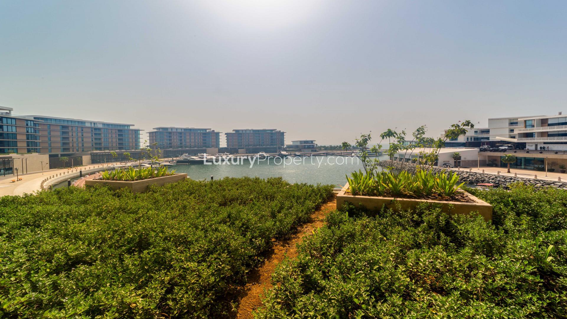 Luxurious open-plan living room in Jumeirah Bay Island apartment with sea view