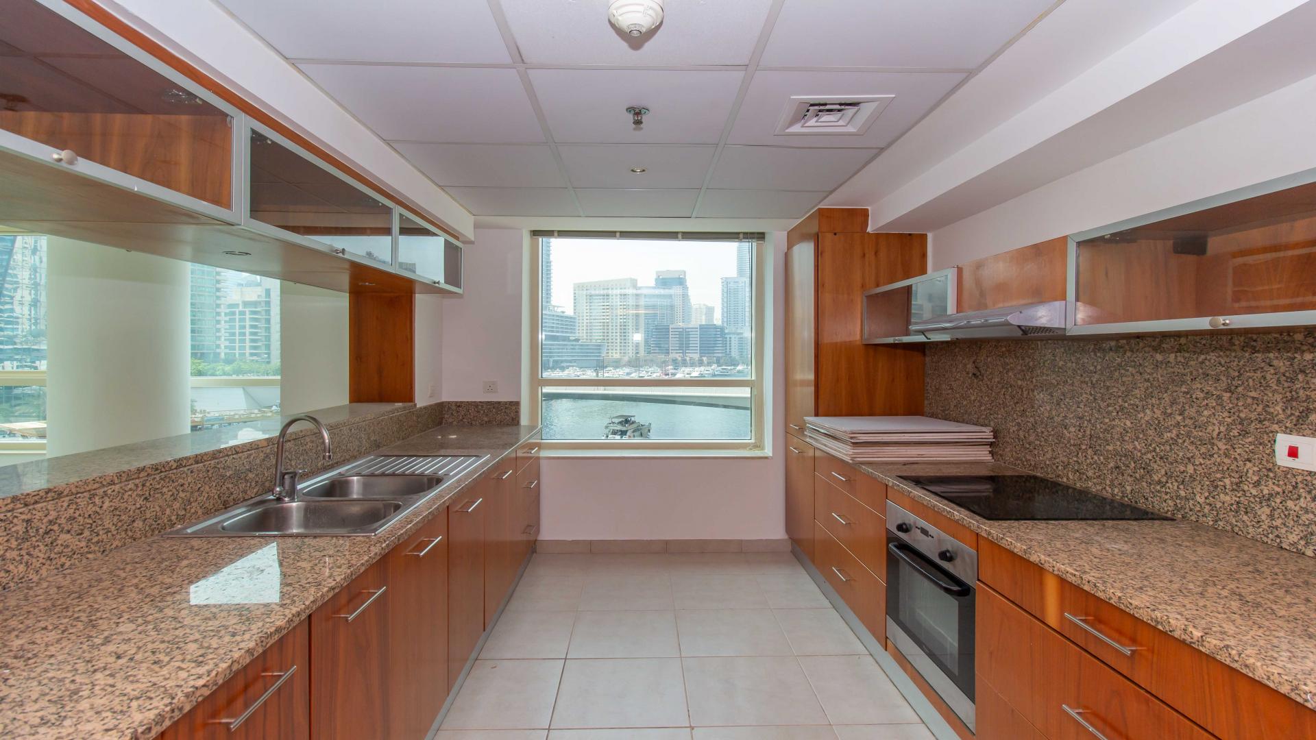 Bright living room with large windows in Dubai Marina apartment, Marina Quay West