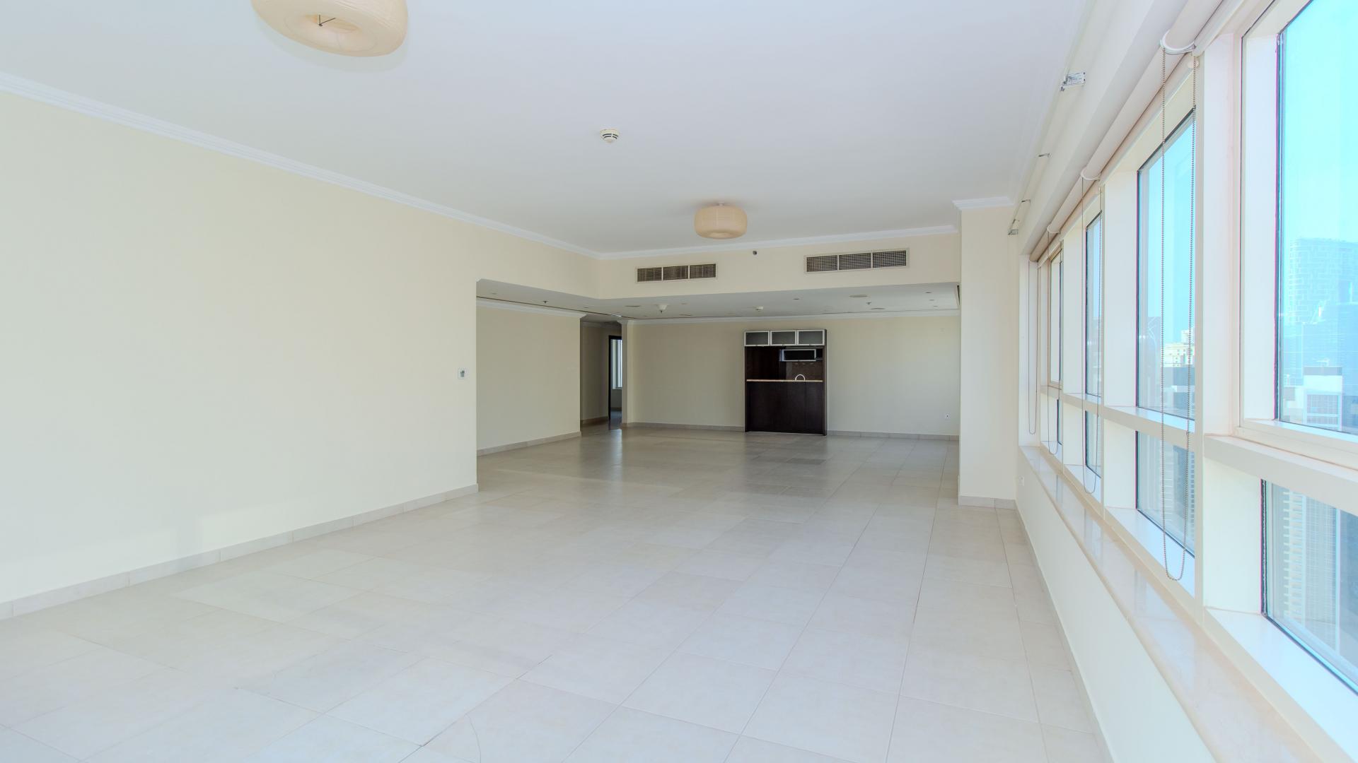 Spacious living area with large windows, Marina Quay West apartment, Dubai Marina