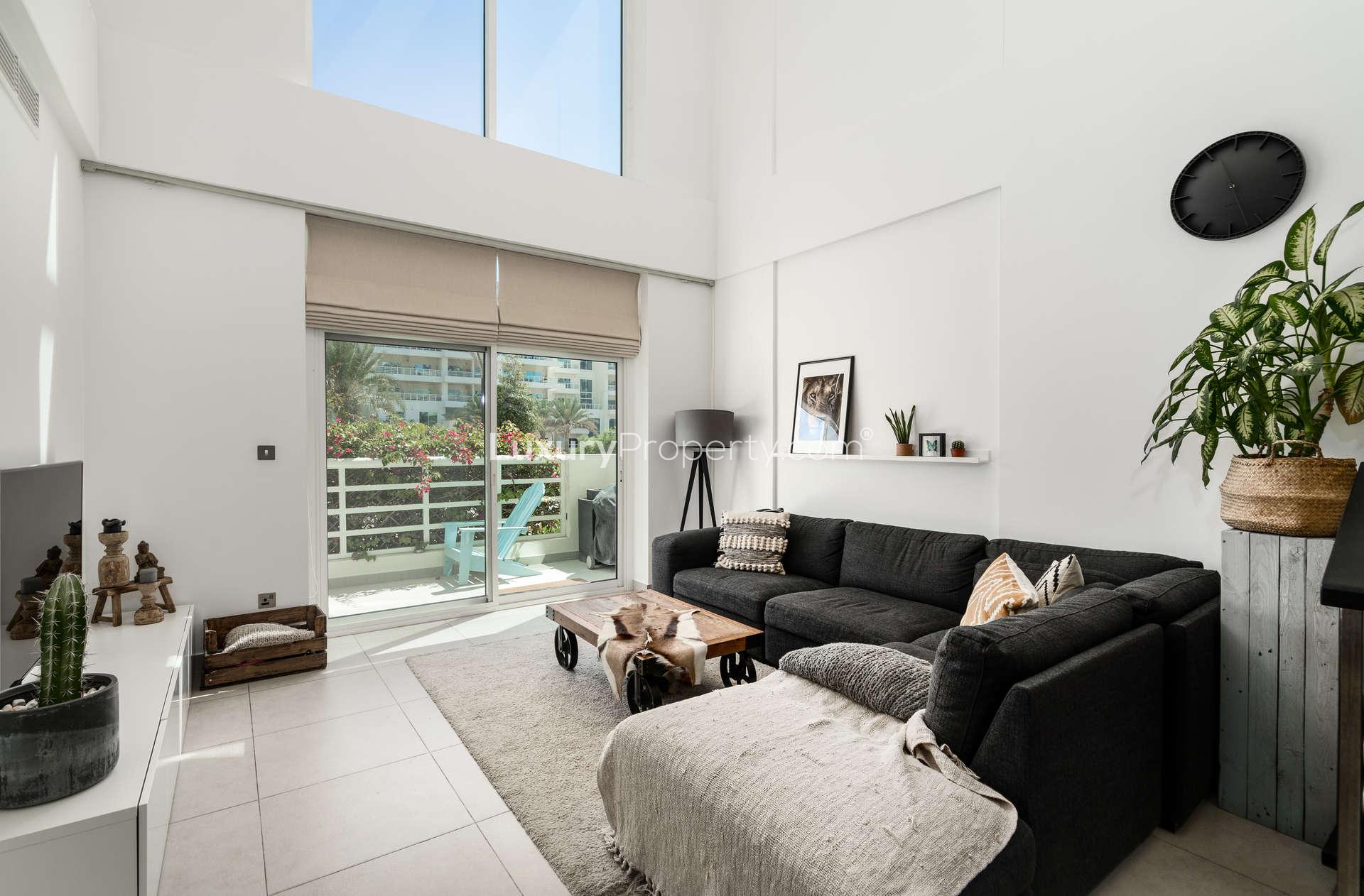 Staircase view in spacious Jumeirah Heights apartment with balcony and garden view