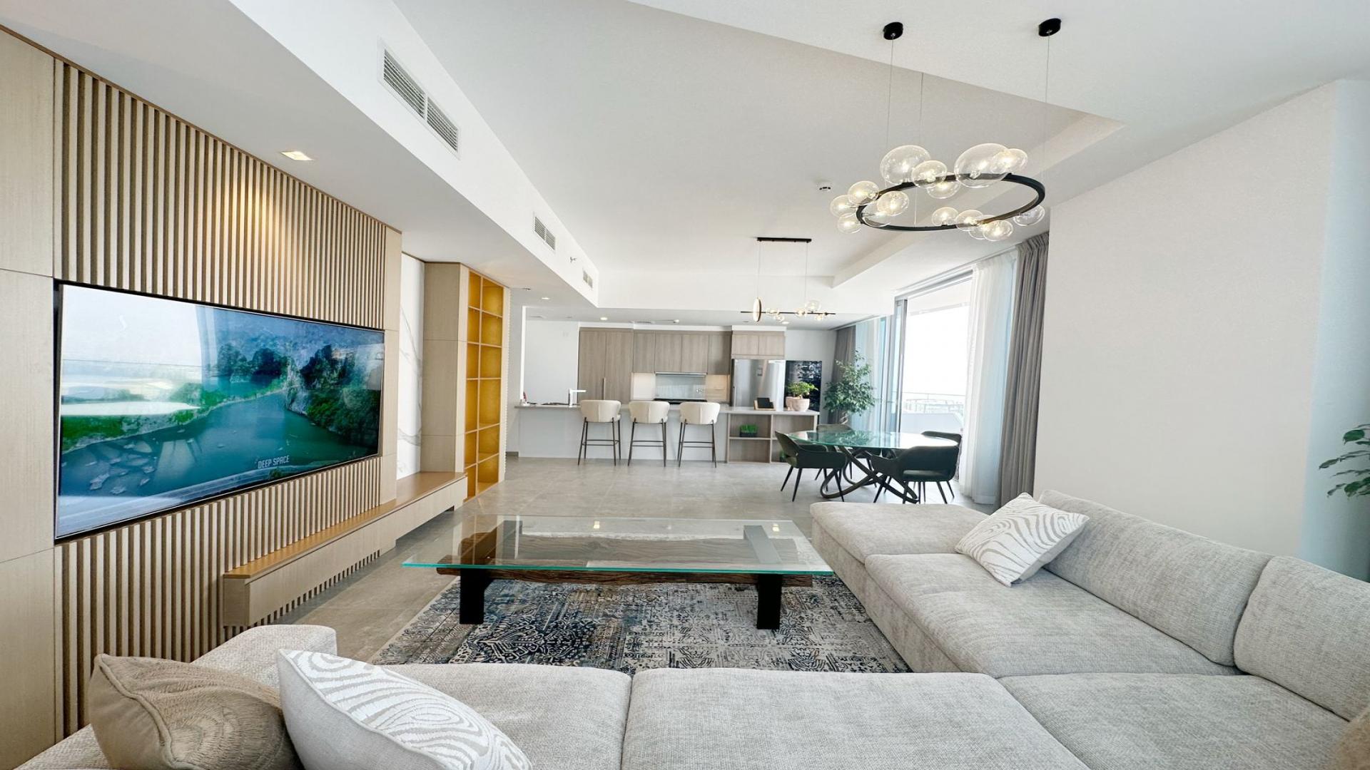 Aerial view of Dubai Marina skyline and waterfront near Stella Maris, showcasing luxury apartments