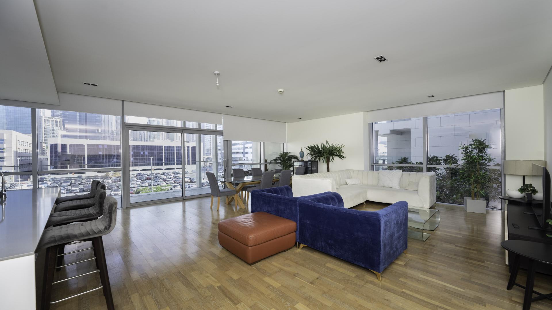 Stylish open-plan living room in 3-bedroom City Walk apartment, modern furnishings, ample space