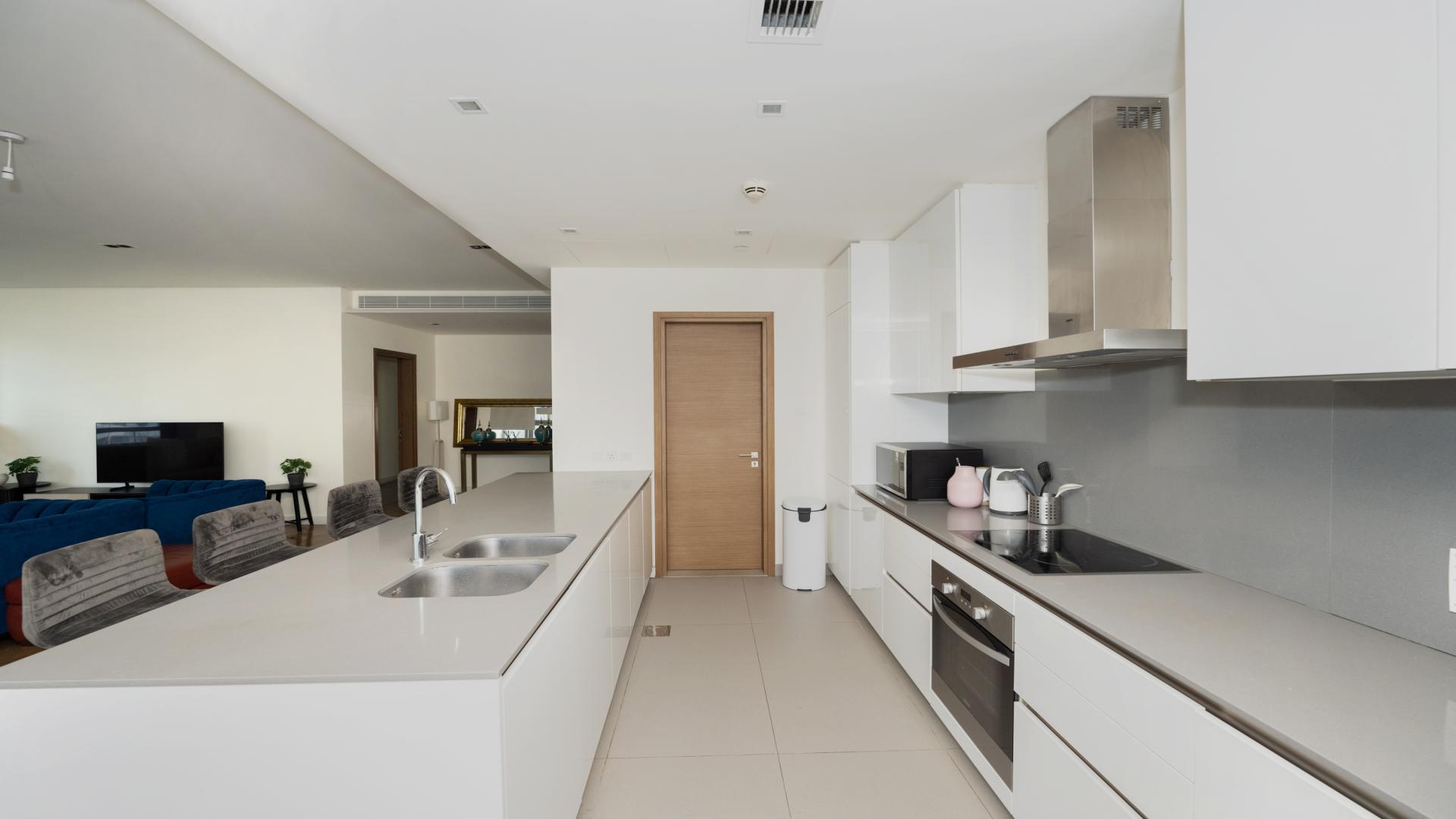 Stylish open-plan living area in 3-bedroom City Walk apartment, featuring modern kitchen and dining space