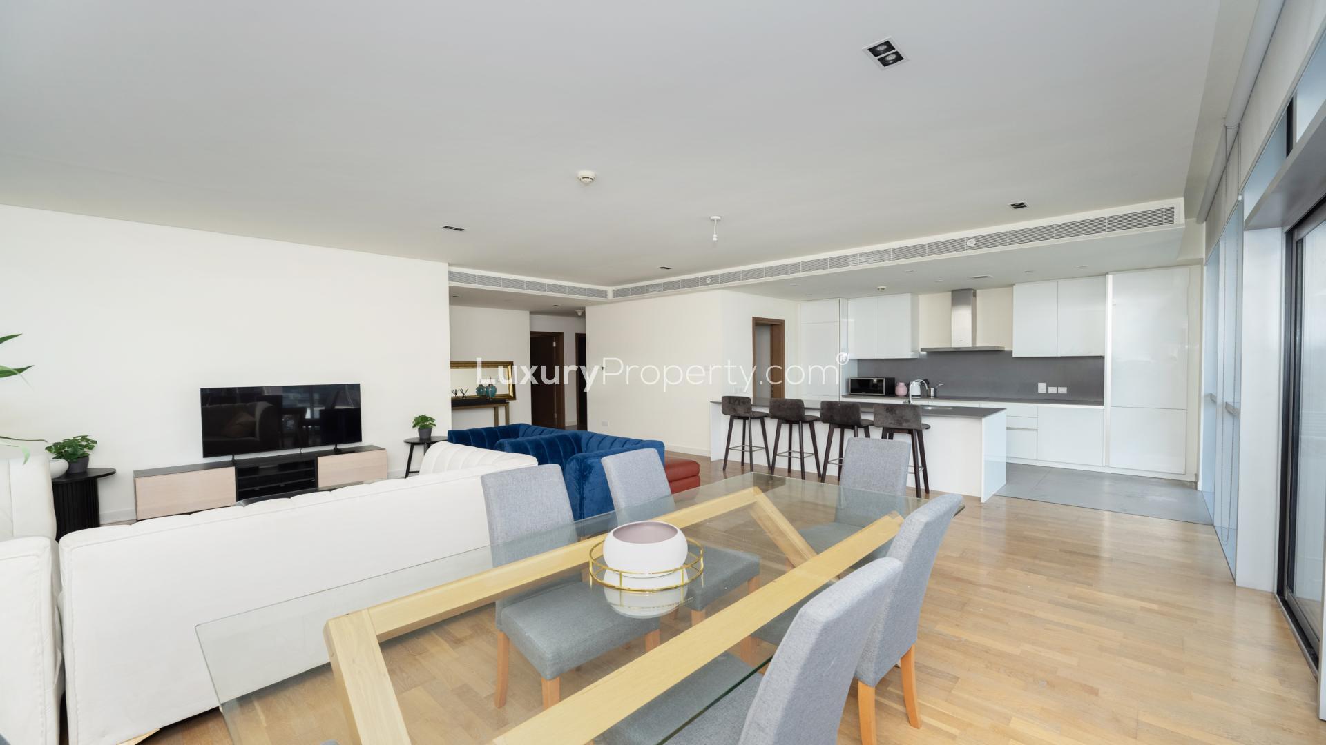 Stylish living room in 3-bedroom City Walk apartment, featuring modern furniture and large windows