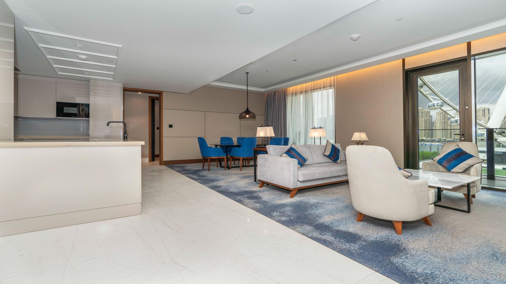Modern living room in Bluewaters Residences apartment, featuring stylish furniture and city views