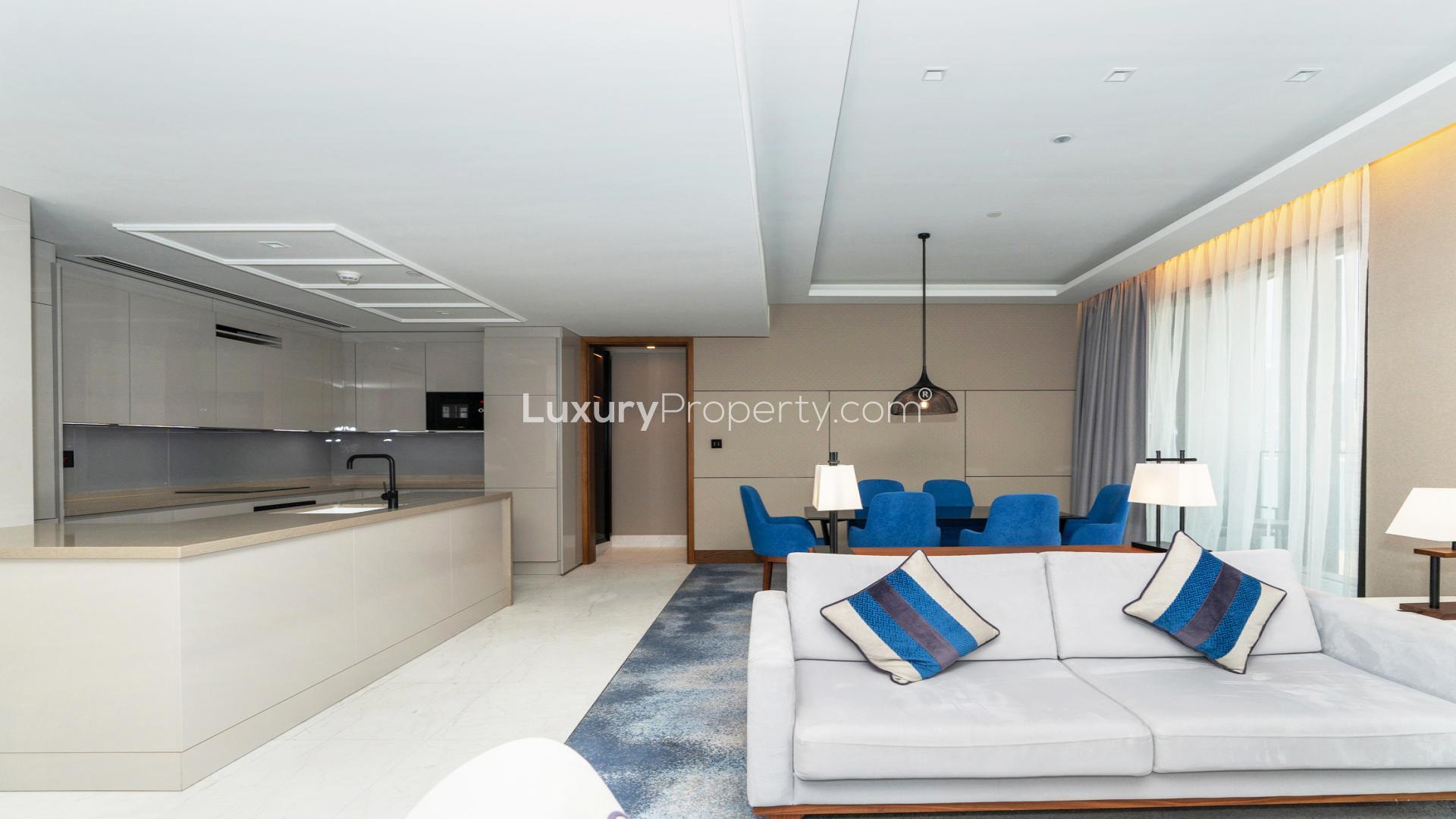 Modern living room in Bluewaters Residences apartment, featuring elegant decor and city views