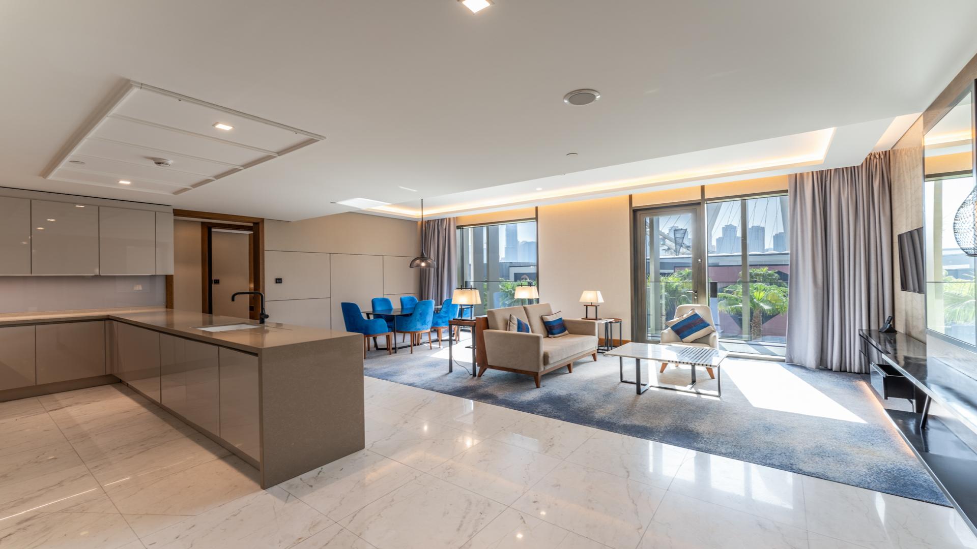 Modern living room in Bluewaters Residences apartment, featuring stylish decor and open layout