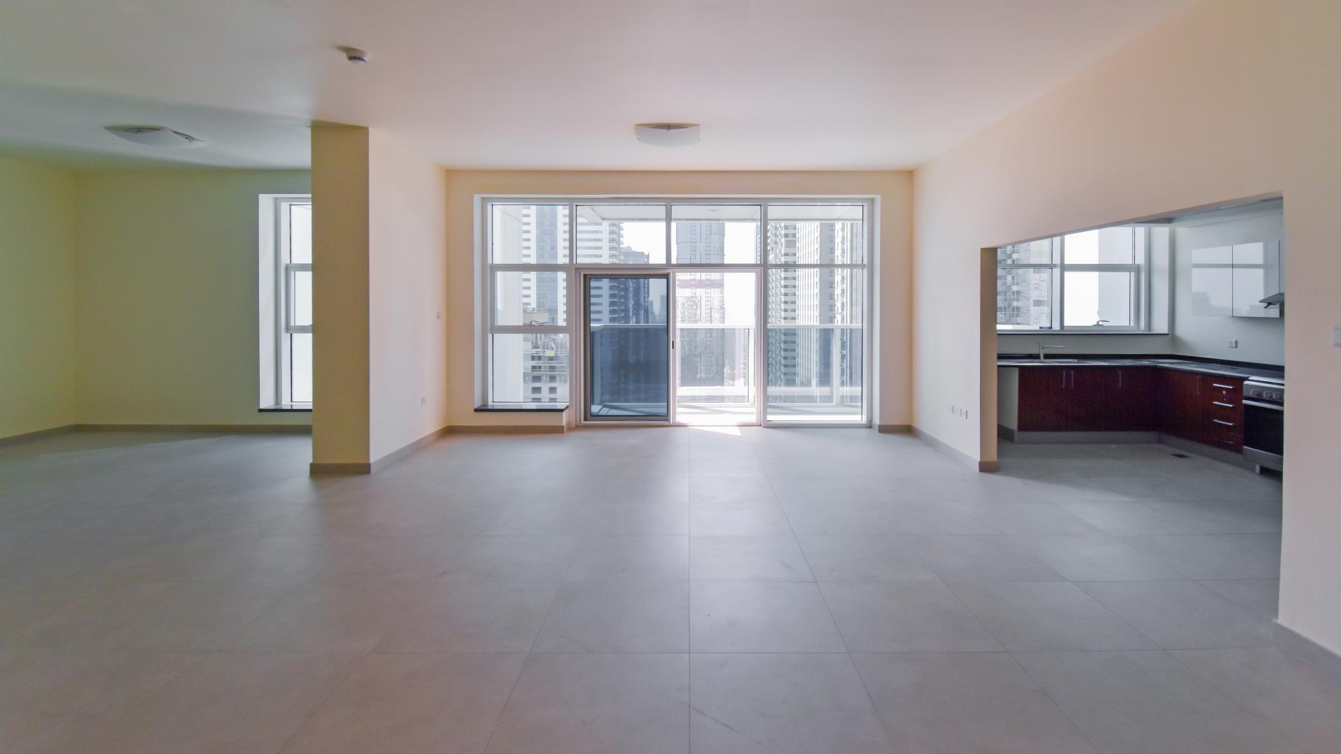 Spacious living area with large windows in Marina Arcade apartment, Dubai Marina for rent