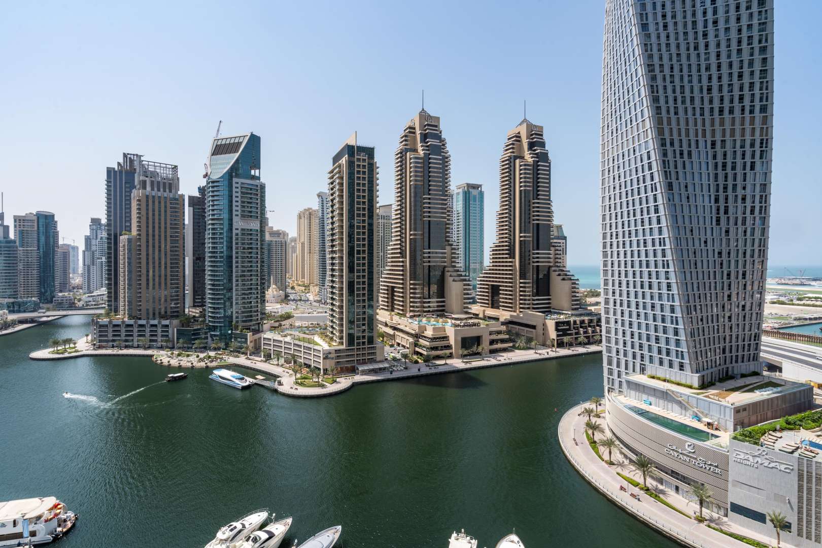 Empty apartment room with large windows overlooking Dubai Marina skyline in Marina Gate 2