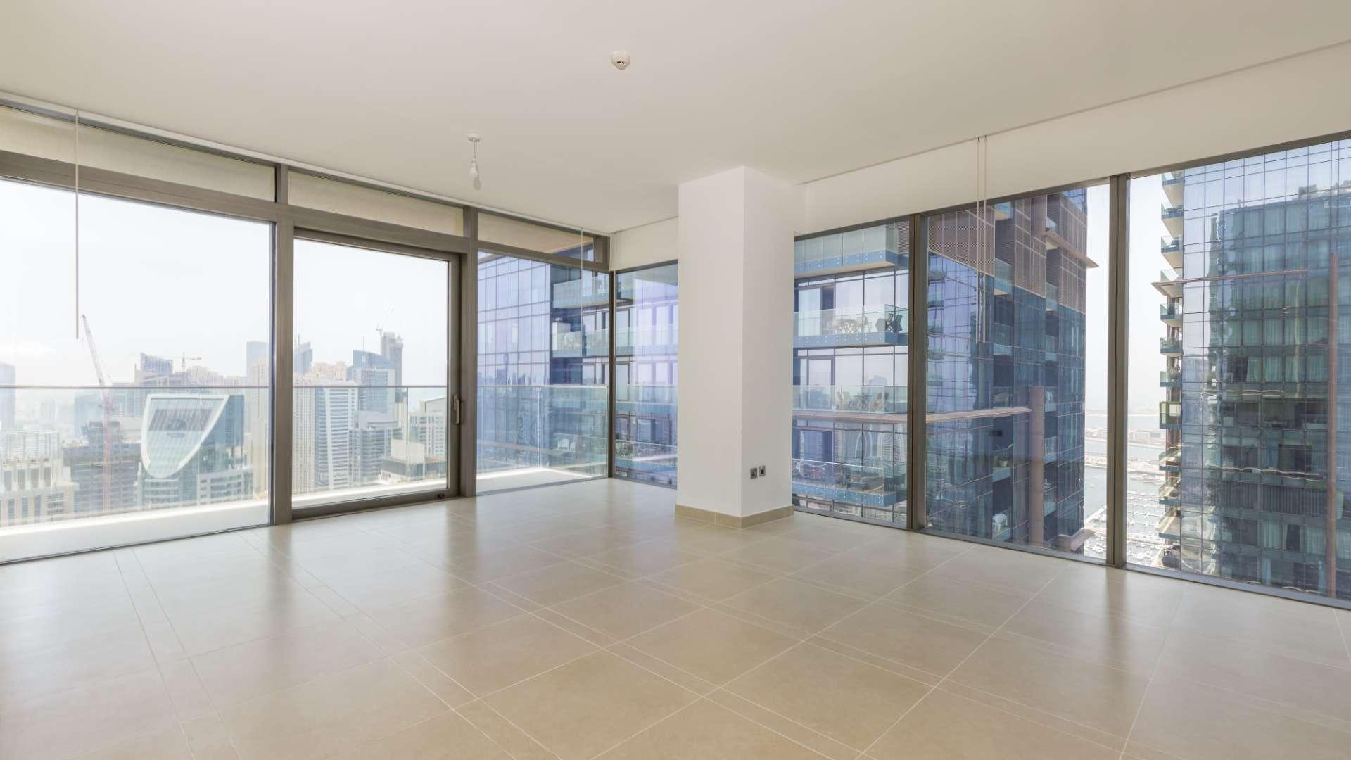 "Spacious balcony with stunning Dubai Marina skyline view, Marina Gate apartment for rent.",Bright living area with floor-to-ceiling windows and stunning Dubai Marina views at Marina Gate