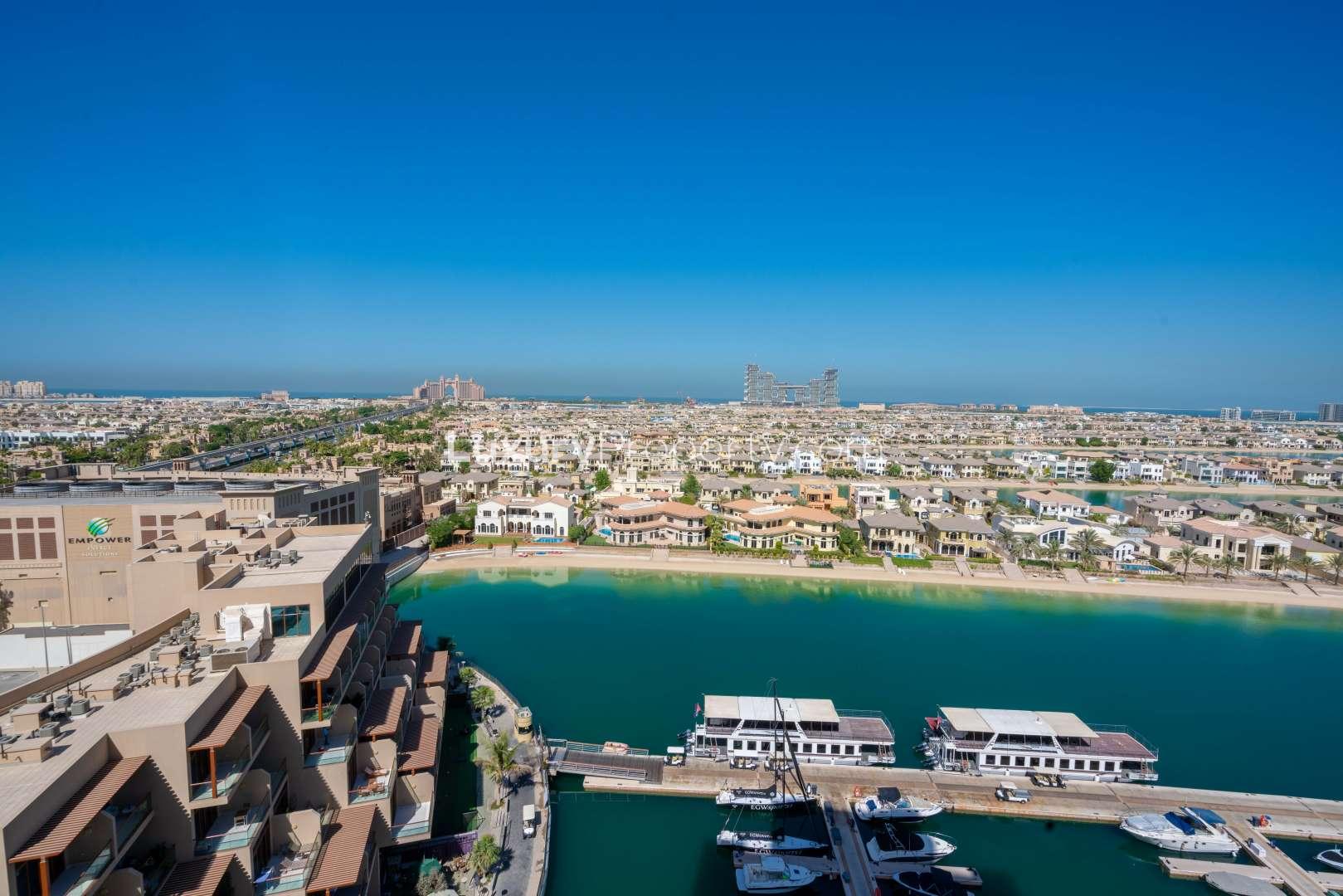 Aerial view of Marina Residences, Palm Jumeirah, showing yachts and luxury waterfront homes