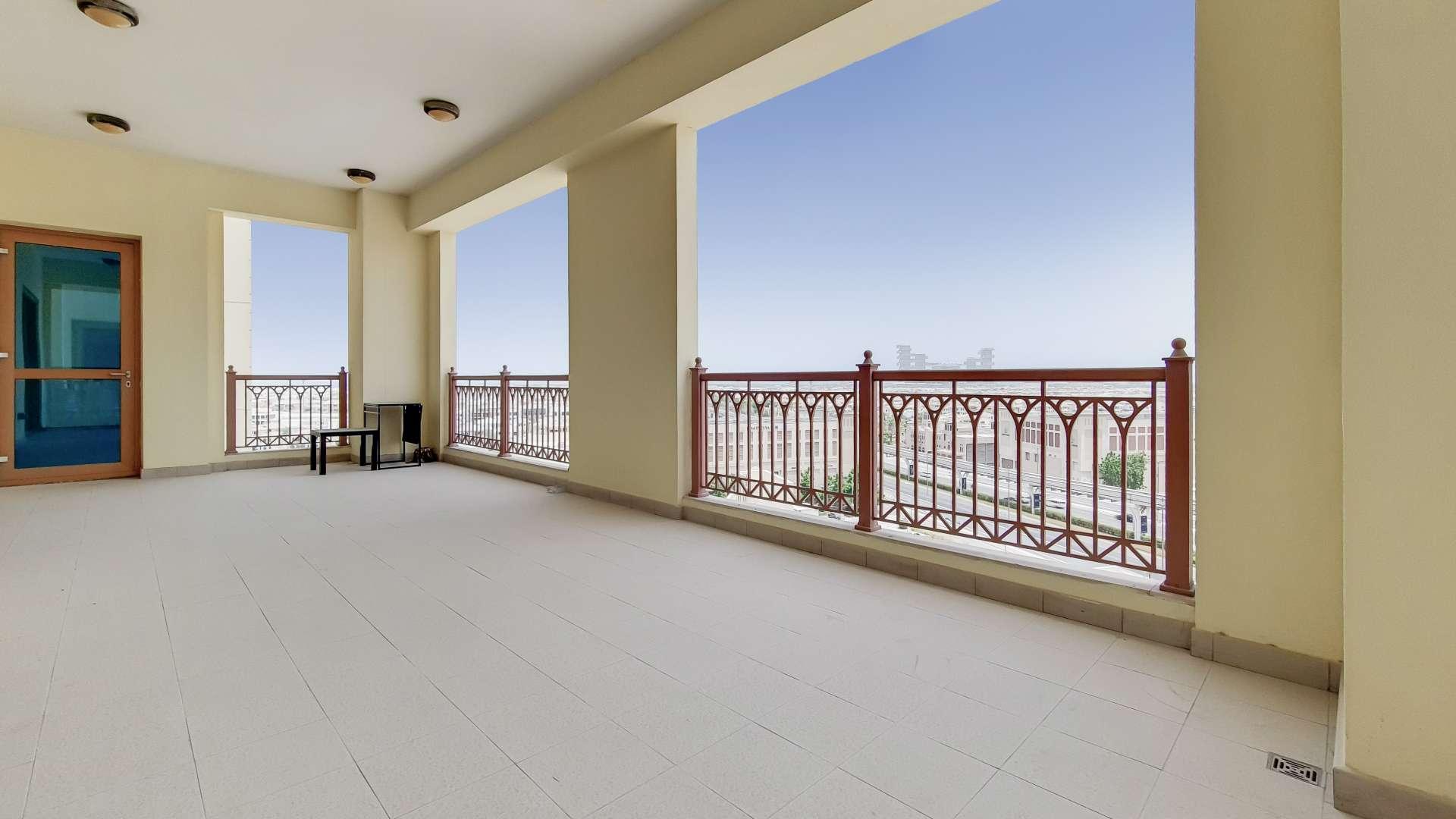 Spacious living room in Marina Residences apartment, Palm Jumeirah, with large windows and tiled floor