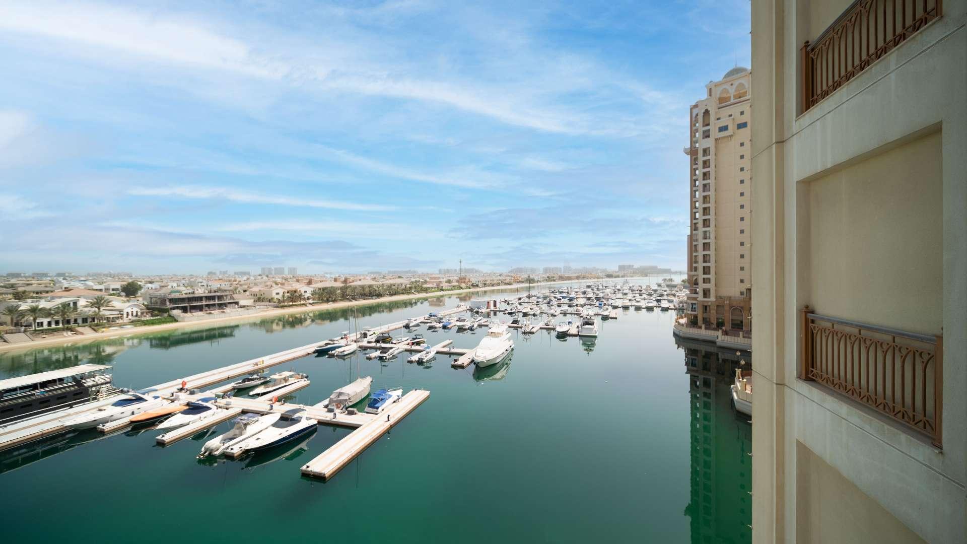 Vacant Palm Jumeirah apartment with large windows showcasing stunning Atlantis views