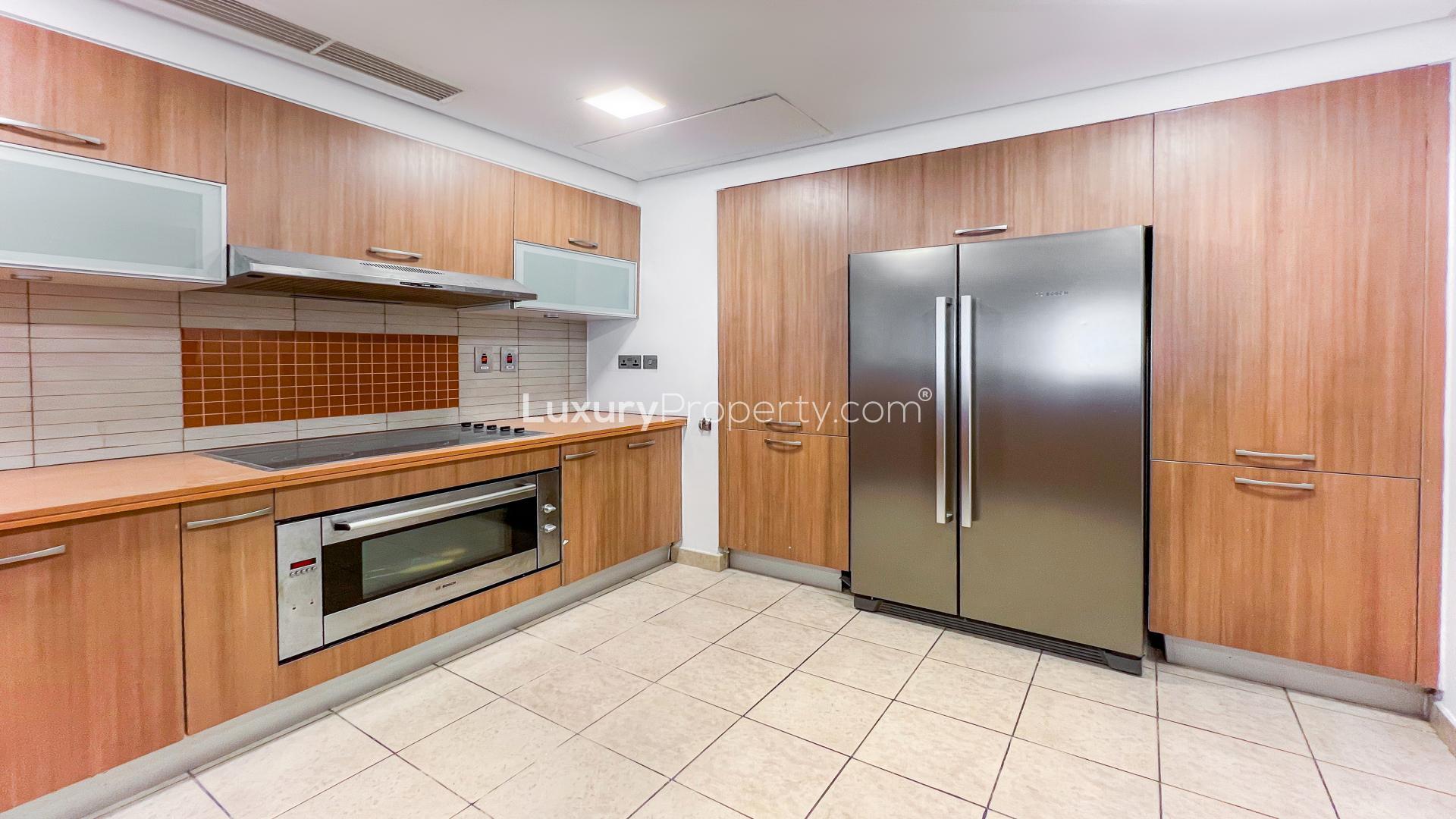 Spacious living room in Palm Jumeirah apartment, Marina Residences, large windows, tiled floor