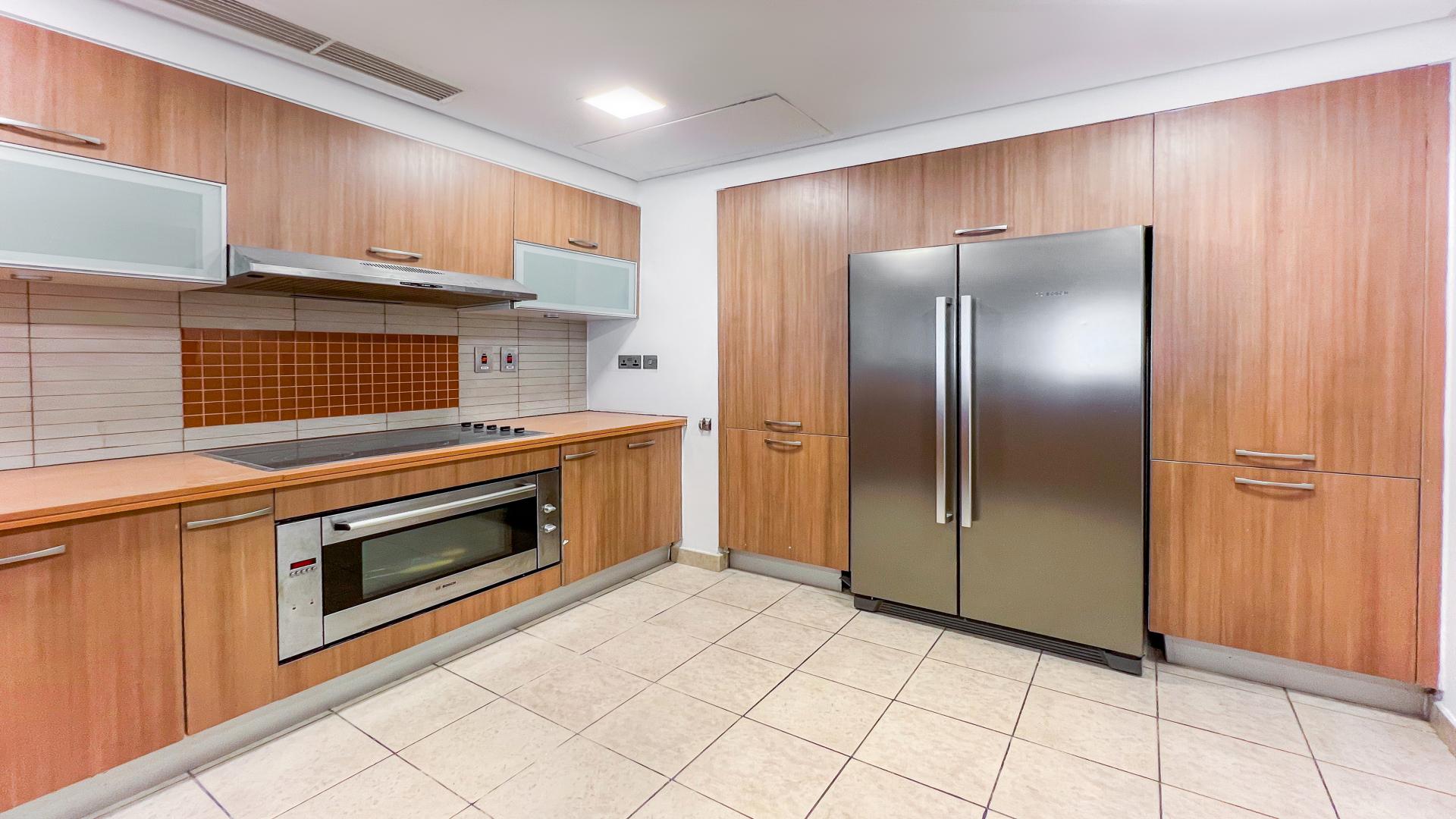 Spacious living room in Palm Jumeirah apartment, Marina Residences, large windows, tiled floor