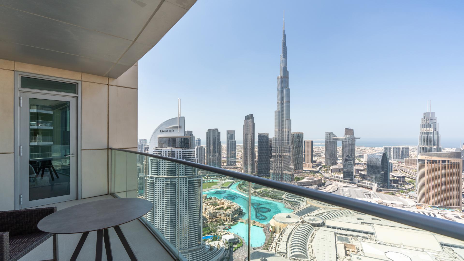 Luxurious living room in 3-bedroom Downtown Dubai apartment with Burj Khalifa views, elegant decor