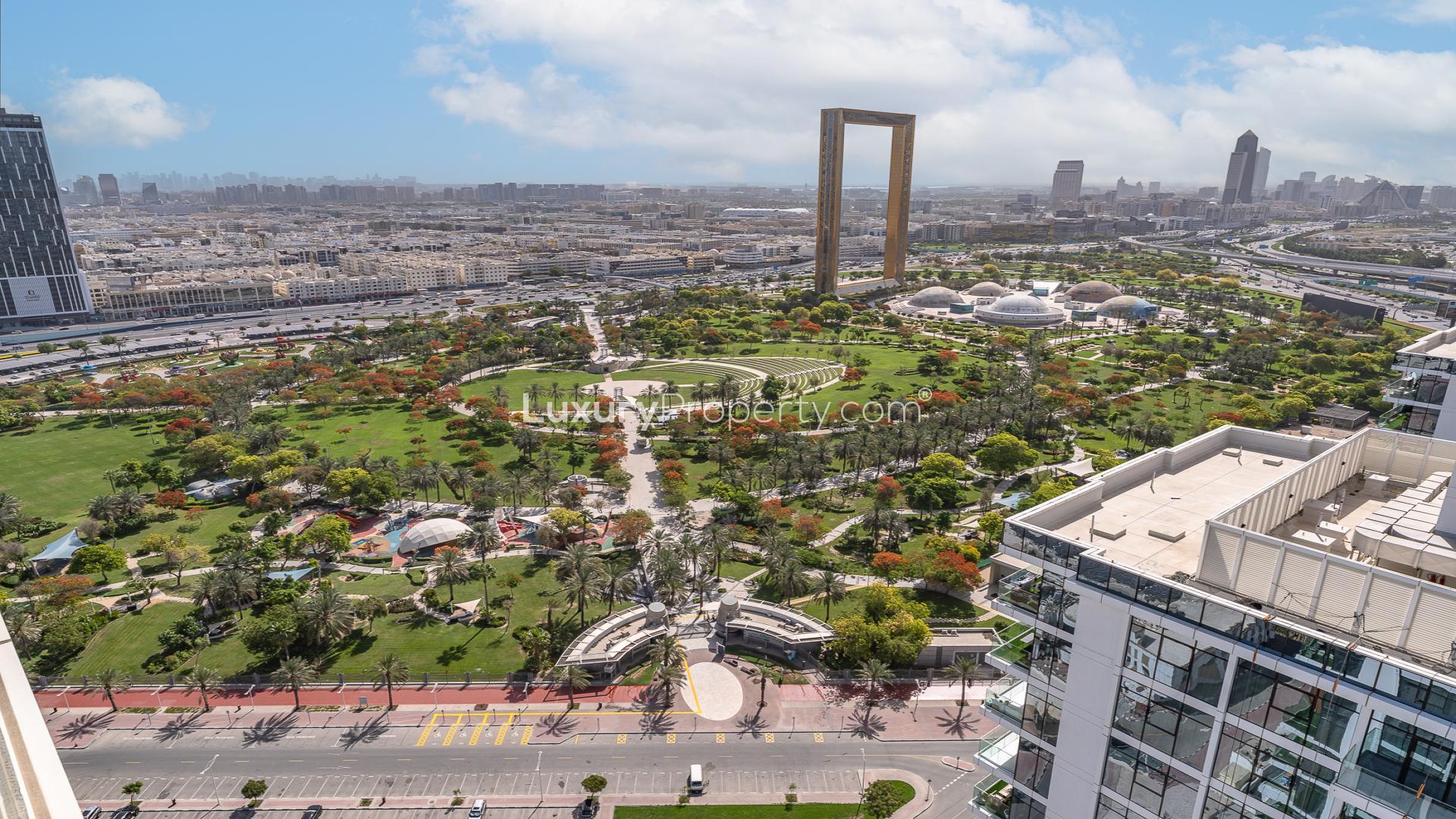 High-floor apartment balcony with partial park view in Al Wasl Gate, Park Gate