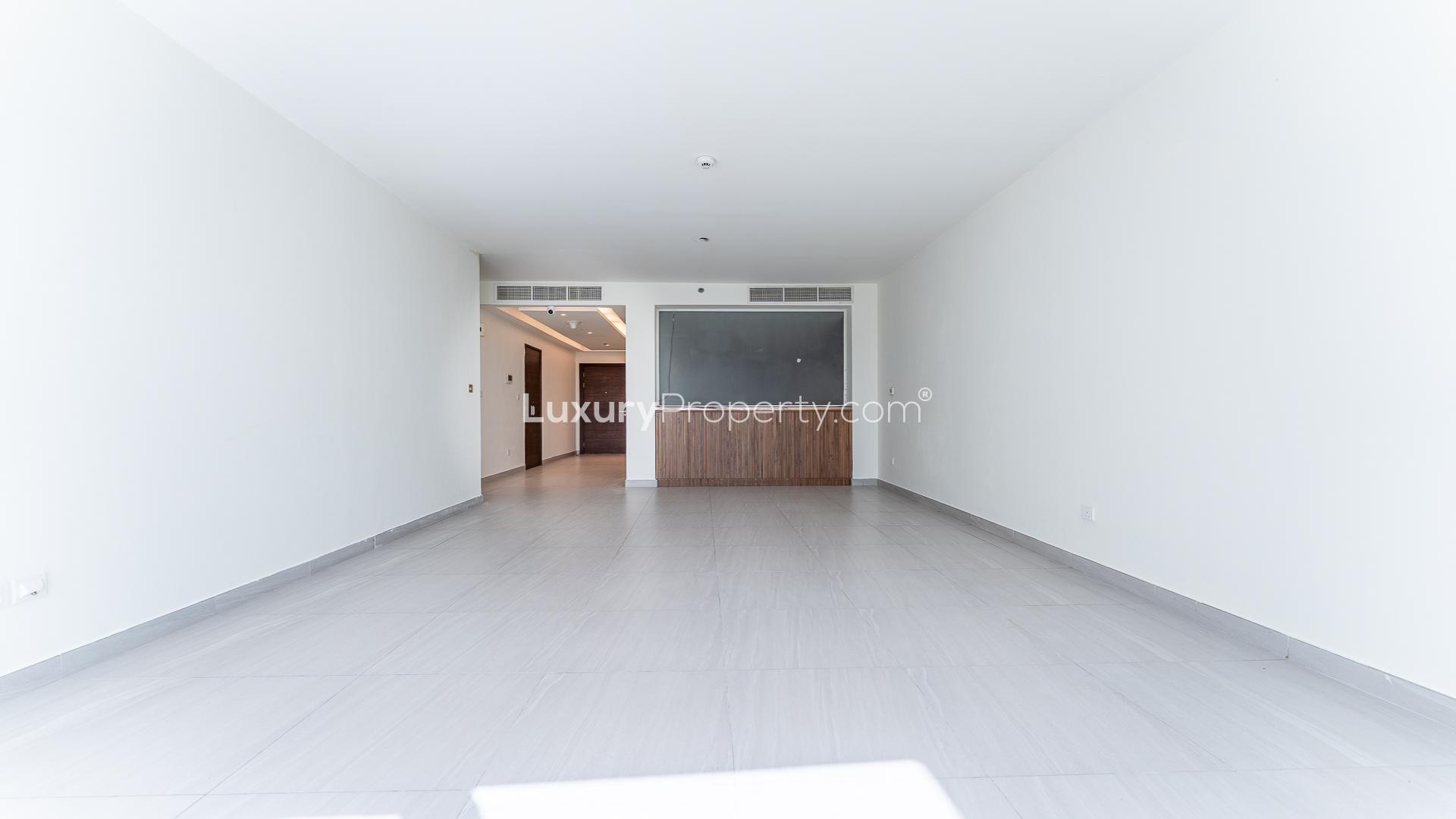 High-floor apartment balcony with cityscape and partial park view in Park Gate, Al Wasl Gate
