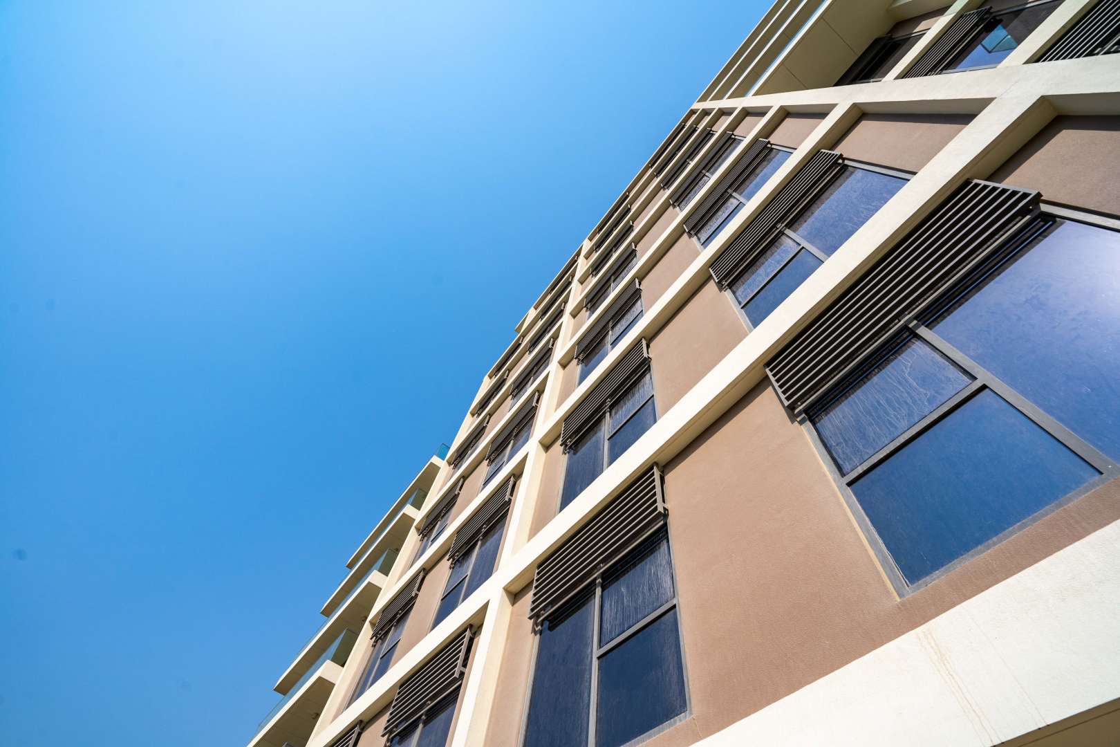 Modern apartment buildings in Dubai Hills Estate's Park Heights community with landscaped surroundings