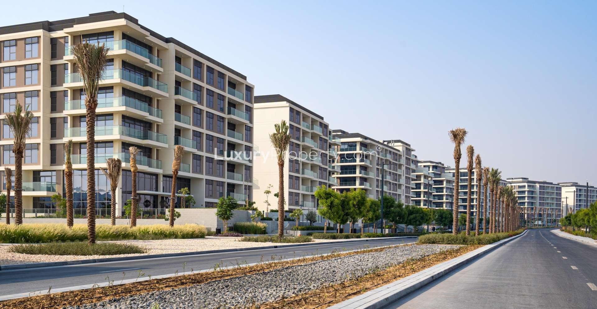 Outdoor pool area at Dubai Hills Estate apartment complex, Park Heights, with modern architecture
