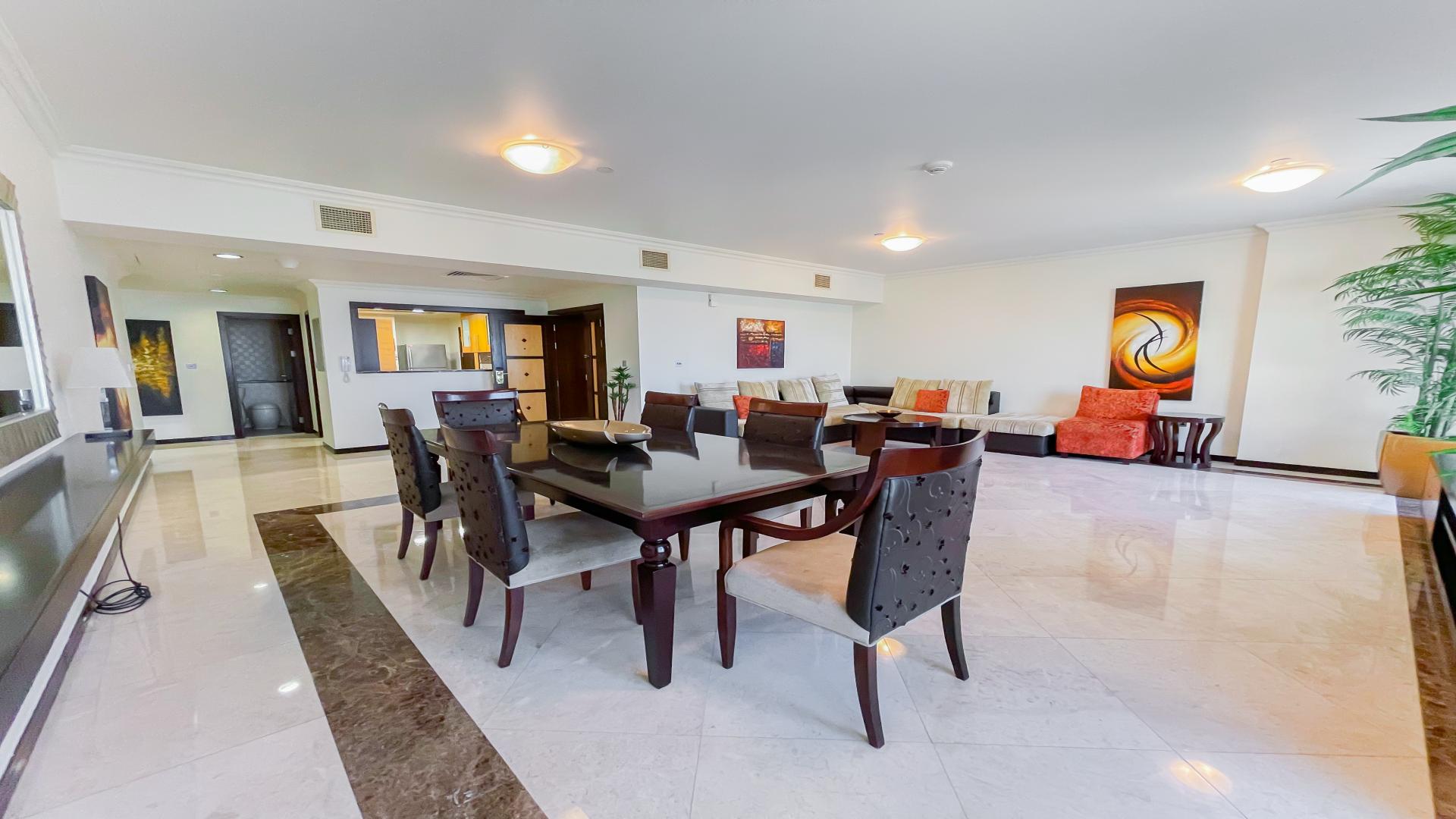 Spacious living area in Jumeirah Beach Residence apartment, Murjan, with elegant dining setup