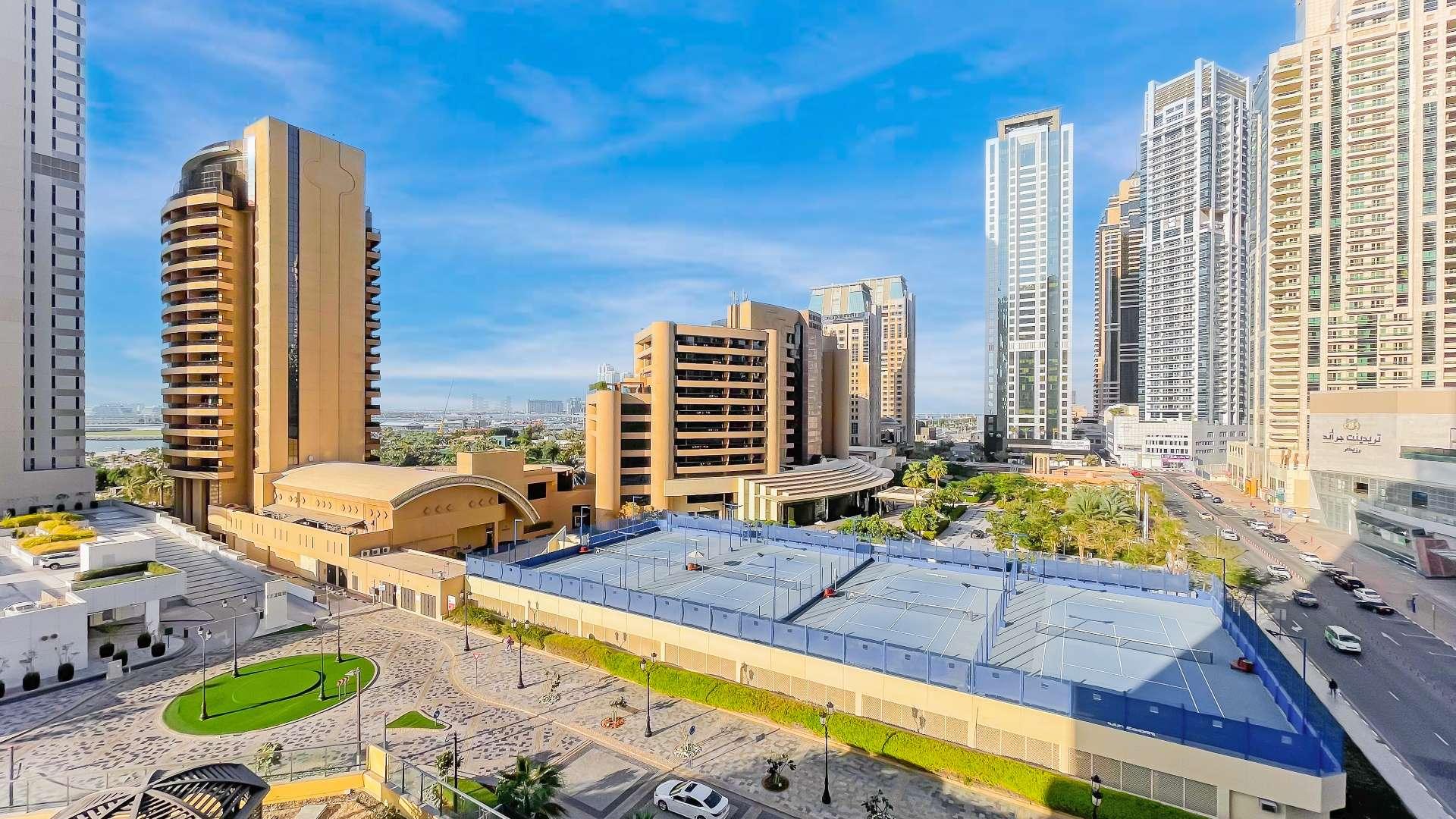 Spacious living room in Murjan apartment, Jumeirah Beach Residence, with modern decor and sea view