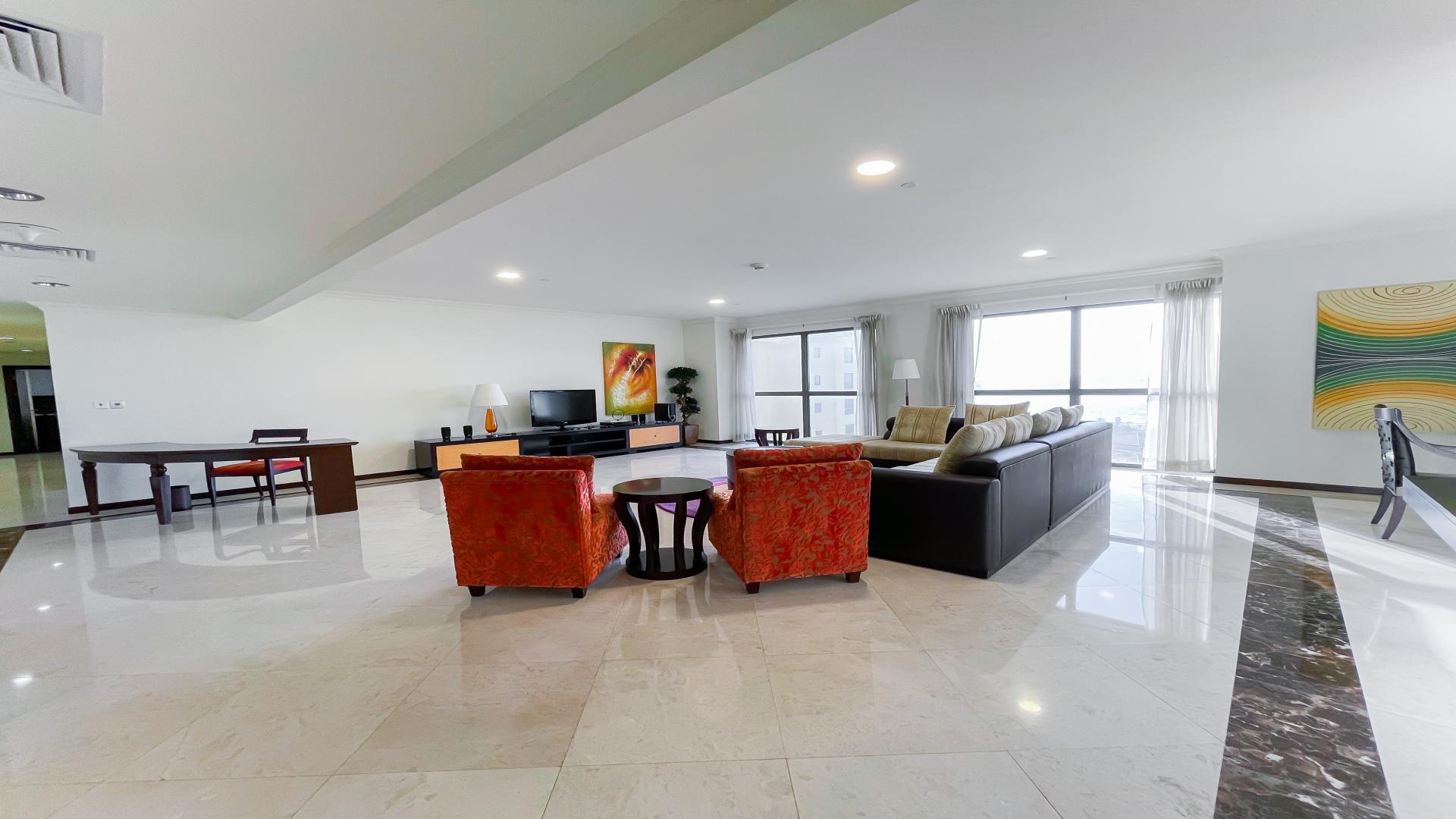 Spacious living room in JBR apartment, modern furniture, large windows with sea views