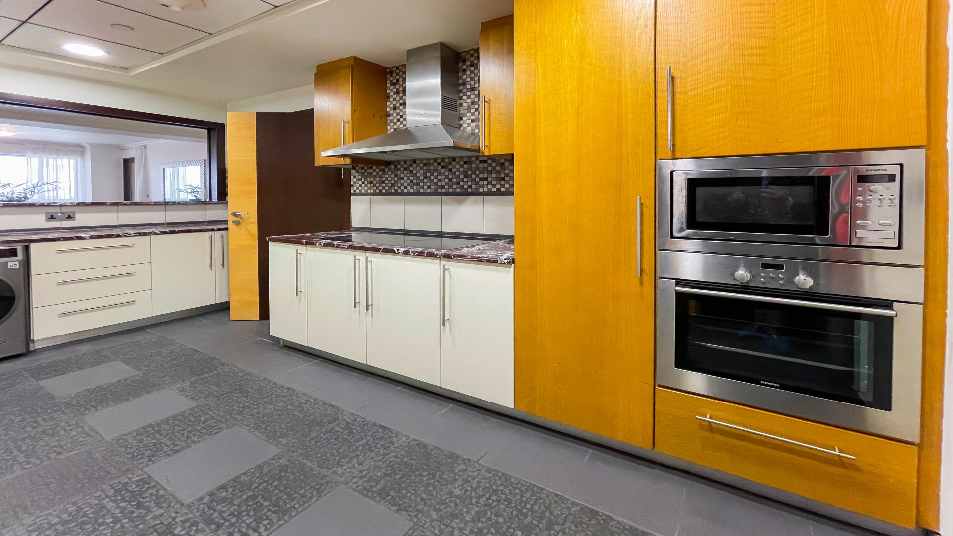 "Murjan apartment exterior in Jumeirah Beach Residence with marina and palm views for rent.","Modern kitchen in fully upgraded Jumeirah Beach Residence apartment, featuring sleek appliances and cabinetry.",Outdoor pool area at Murjan, Jumeirah Beach Residence apartment for rent, LP11240