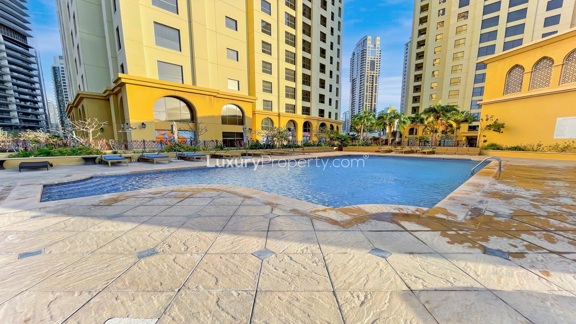 "View from Murjan apartment, Jumeirah Beach Residence, overlooking tennis courts and skyline.",Luxurious bathroom in upgraded Jumeirah Beach Residence apartment, Murjan community, for rent